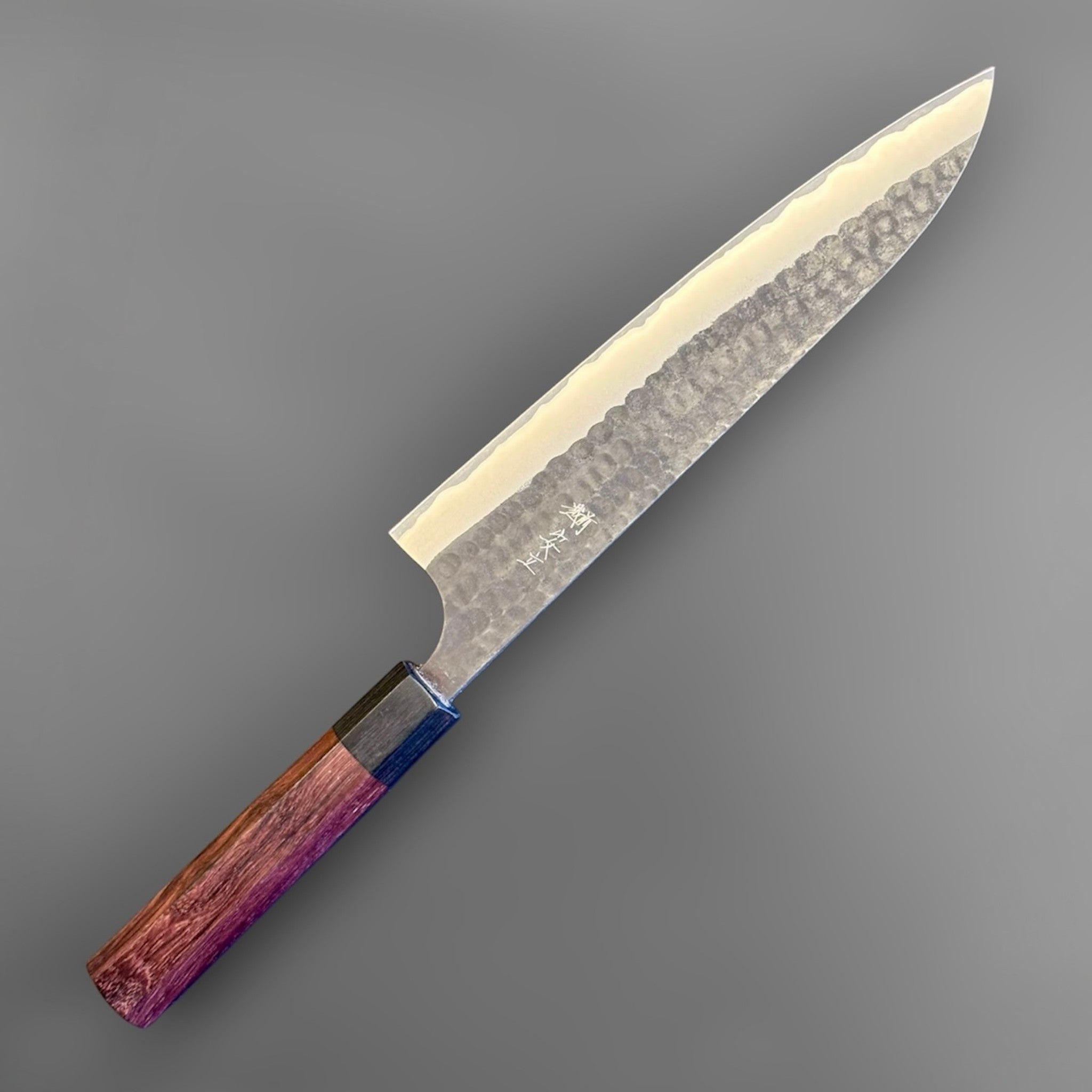Anryu Aogami Super Kurouchi Gyuto 210 mm, full side profile with kurouchi finish, hammered tsuchime texture, and purple-toned octagonal wa handle.