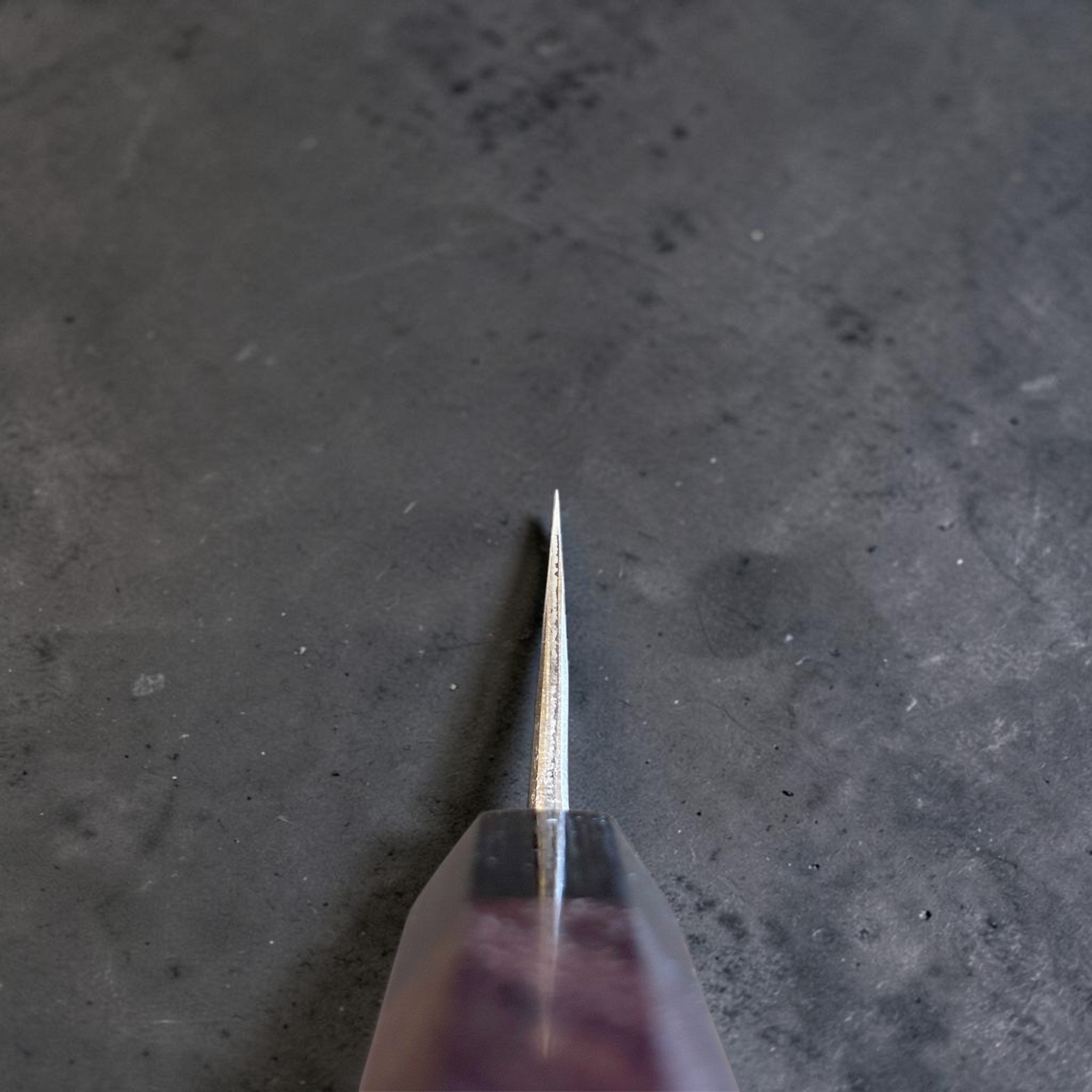 Anryu Aogami Super Kuro Tsuchime Petty 150 mm, spine-on detail showing the narrow grind and thin tip for precise prep work.