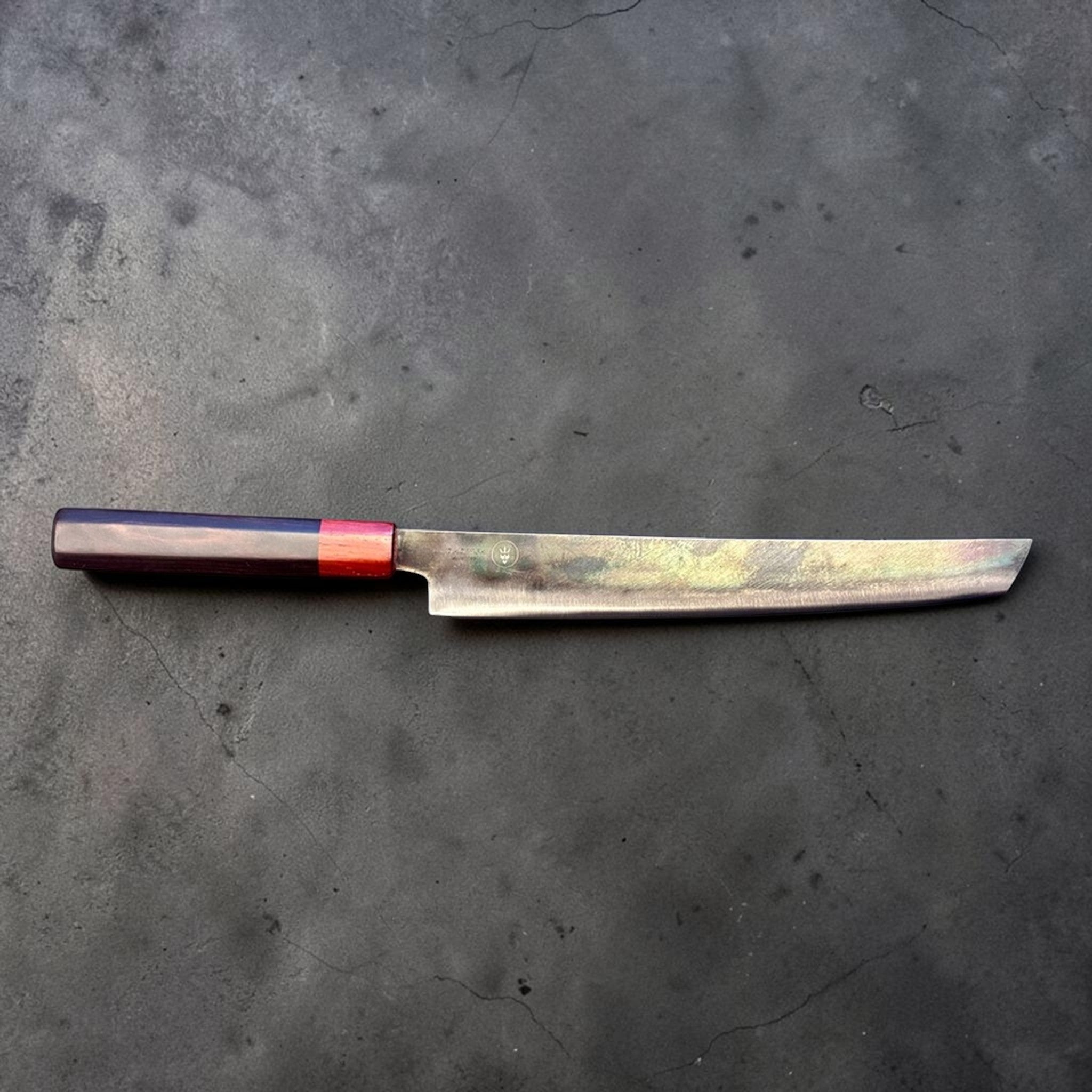 Dao Vua V3 52100 carbon steel 270 mm sakimaru sujihiki slicer, full profile side view with dark wa handle and red ferrule.