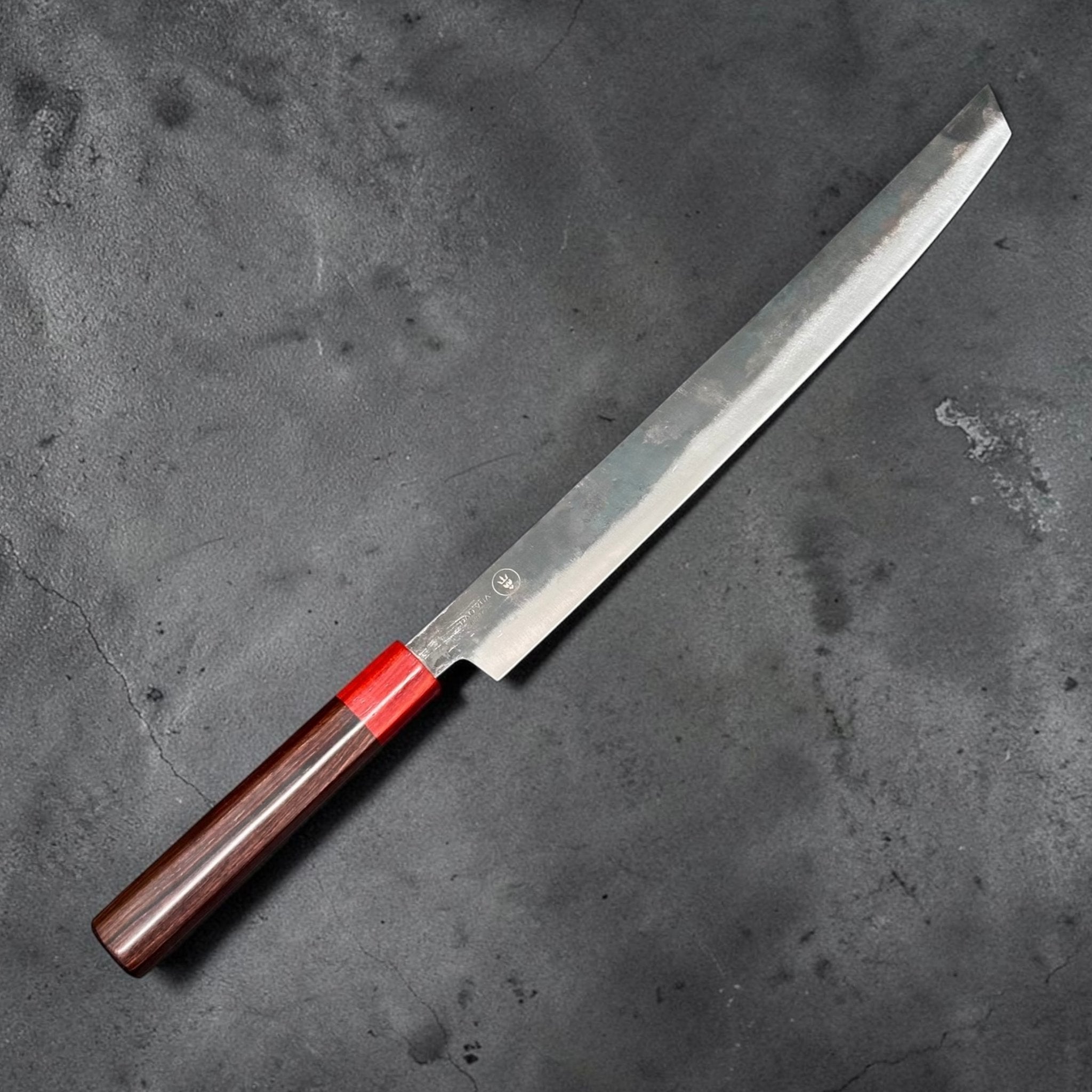 Dao Vua V3 52100 Sujihiki Slicer 350 mm with Hardwood Saya, angled product view showing blade finish, Dao Vua mark, and red ferrule.