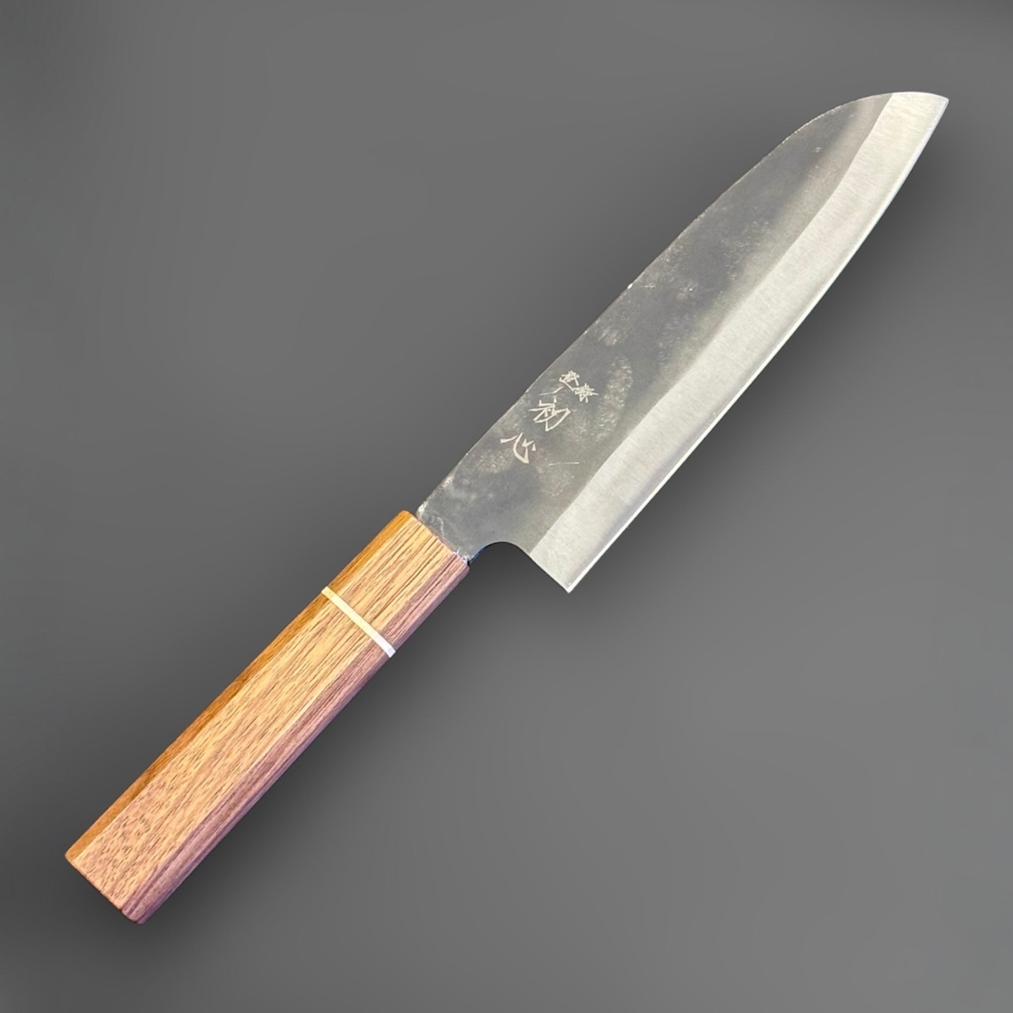 Hatsukokoro Aokitae Blue #2 Kurouchi Santoku 180 mm with Sanjo walnut handle and maple stripe, full side profile showing the kurouchi blade finish.