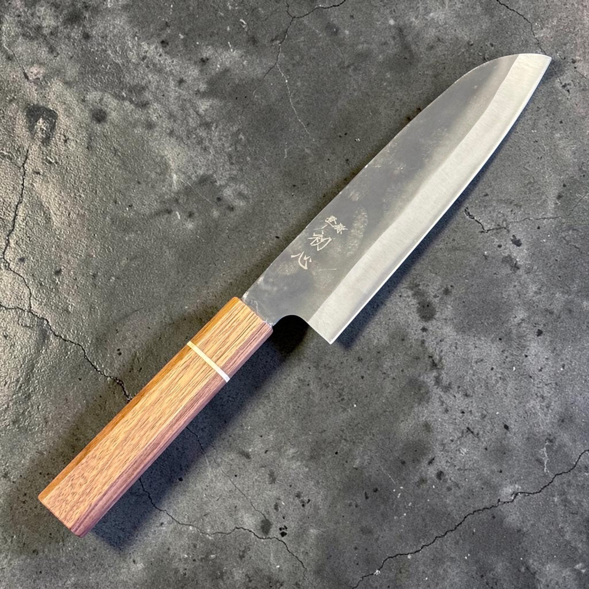 Hatsukokoro Aokitae Blue #2 Kurouchi Santoku 180 mm with Sanjo walnut handle and maple stripe, full side profile showing the kurouchi blade finish.