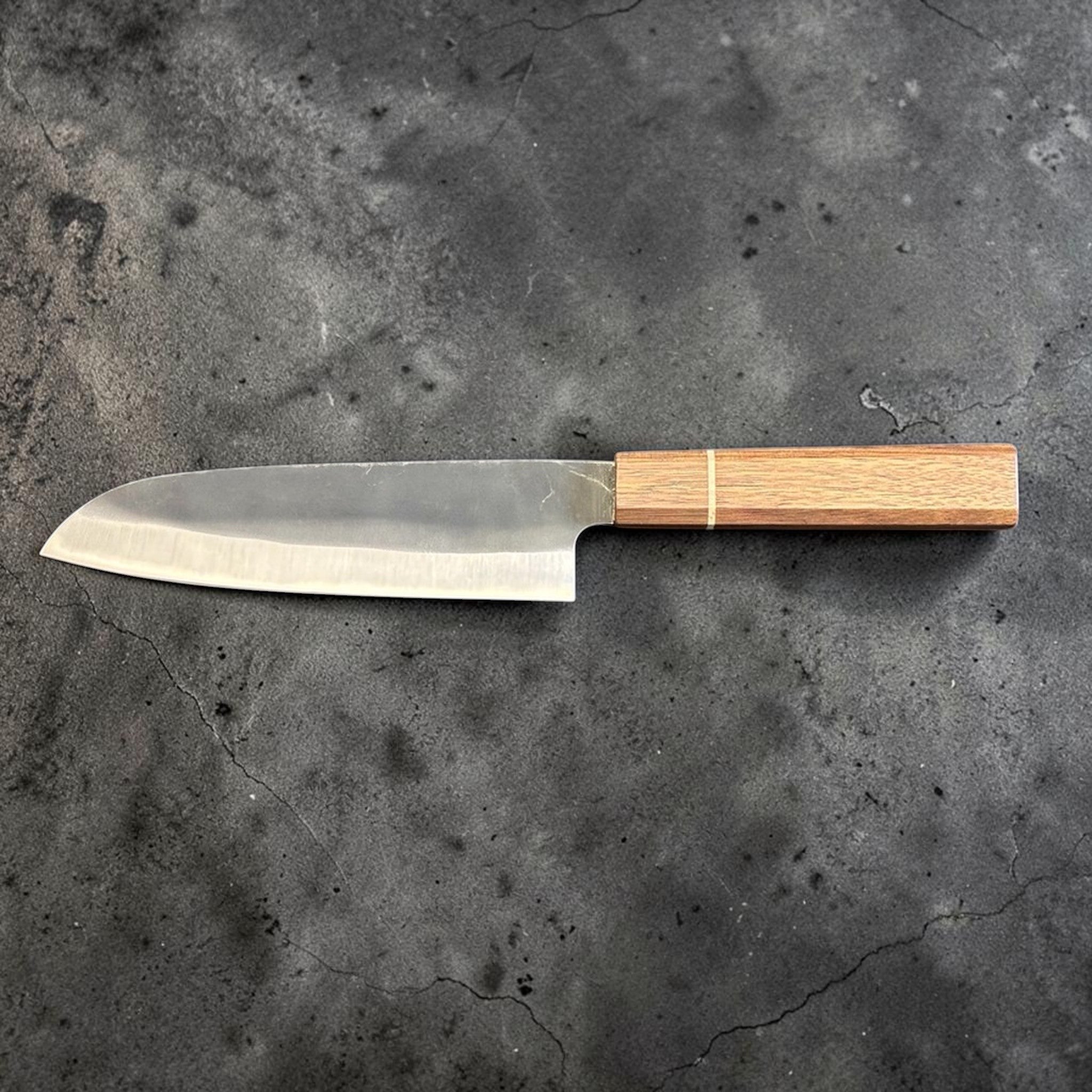Hatsukokoro Aokitae Blue #2 Kurouchi Santoku 180 mm with Sanjo walnut handle and maple stripe, full reverse side profile on gray background.