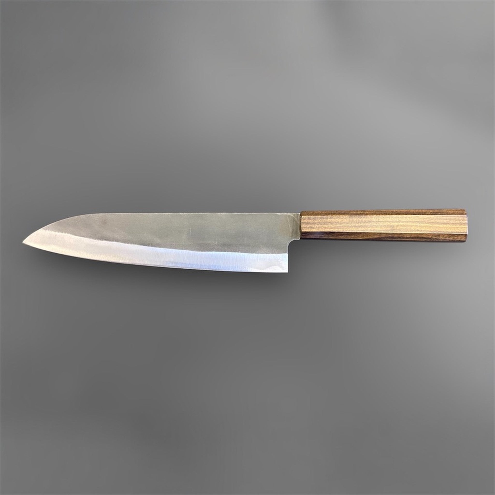 Hatsukokoro Blue #2 Kurouchi Gyuto 220 mm with mono ebony handle, opposite-side full profile on gray background.