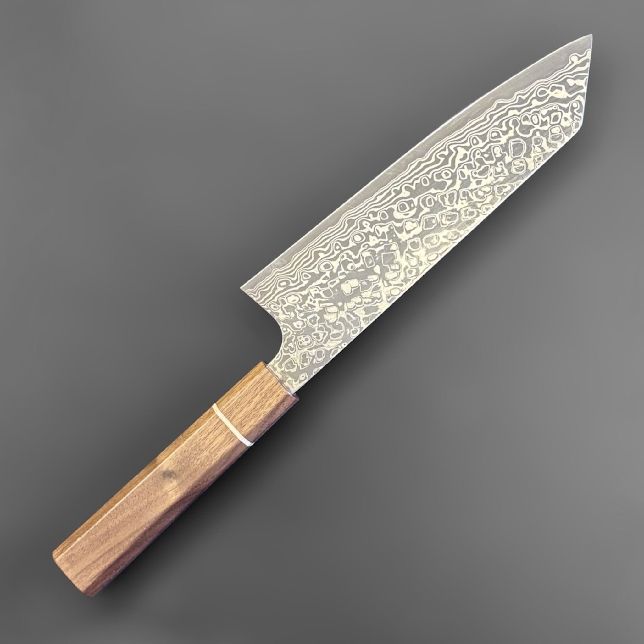 Hatsukokoro Ginga ATS-34 Nickel Damascus Bunka 170 mm with Sanjo walnut handle and maple stripe, angled reverse-side view.