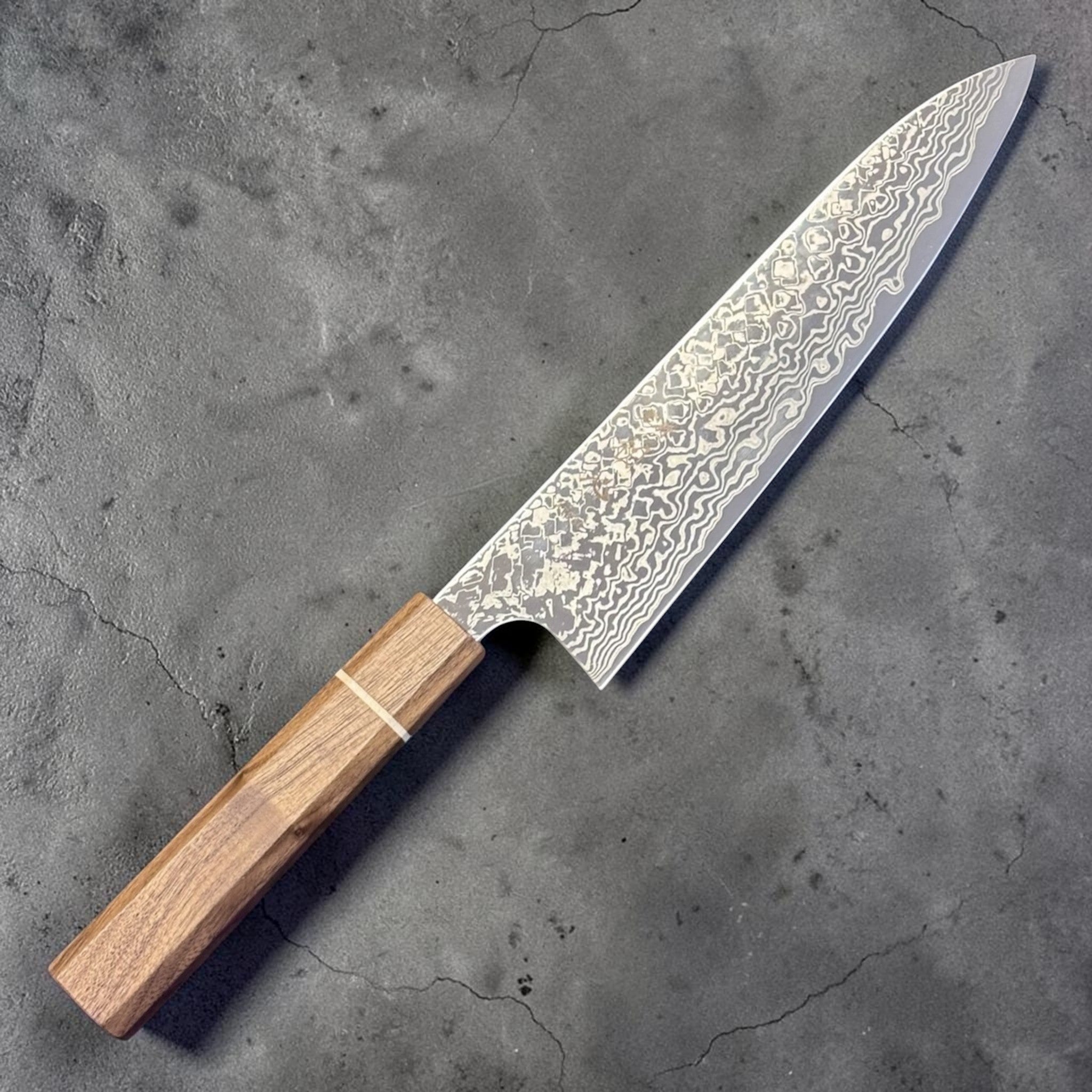 Hatsukokoro Ginga ATS-34 Nickel Damascus Gyuto 210 mm with Sanjo walnut handle and maple stripe, angled view highlighting the Damascus pattern and wa handle.