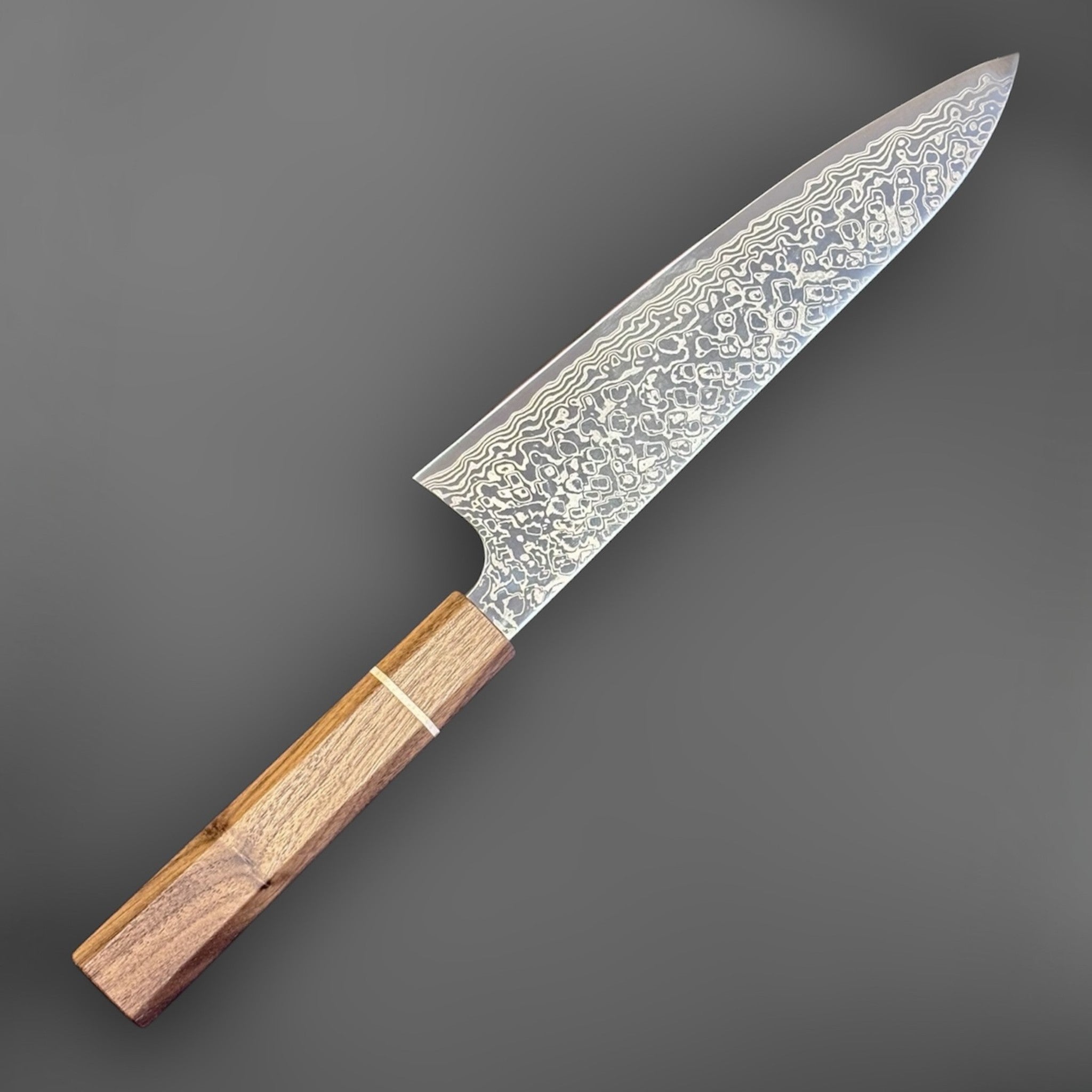 Hatsukokoro Ginga ATS-34 Nickel Damascus Gyuto 210 mm with Sanjo walnut handle and maple stripe, blade-side view emphasizing the nickel Damascus finish.