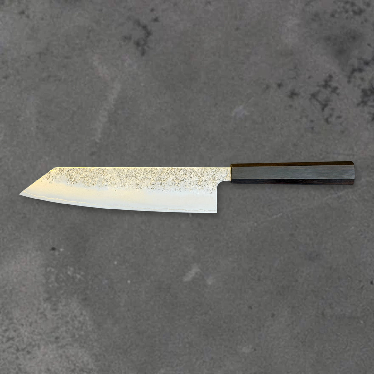 Hatsukokoro Ginrei Ginsan Nashiji 210mm kiritsuke with ebony handle, shown in horizontal reverse profile with the full blade and handle visible.