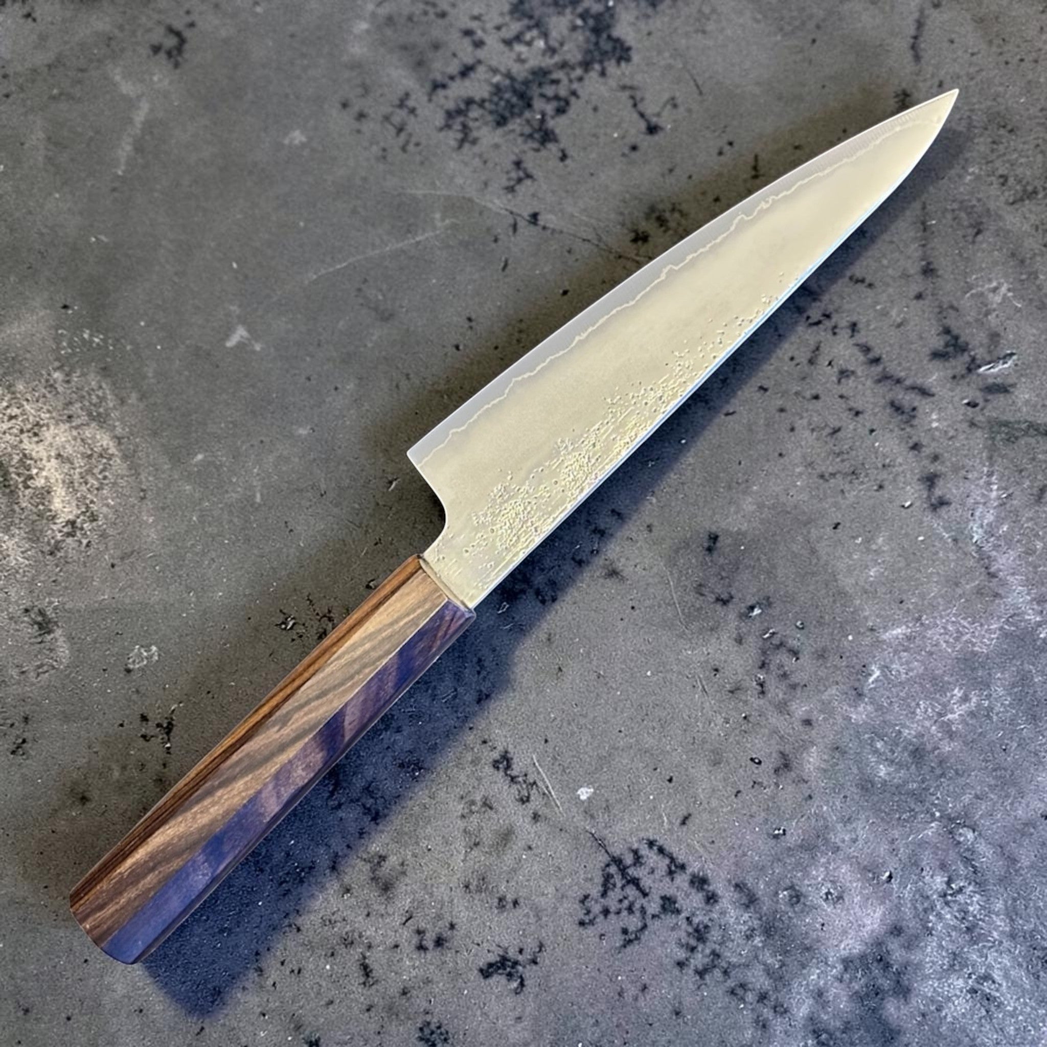Hatsukokoro Ginrei Silver #3 Ko Santoku 150 mm with mono ebony handle, alternate angled blade and handle view.