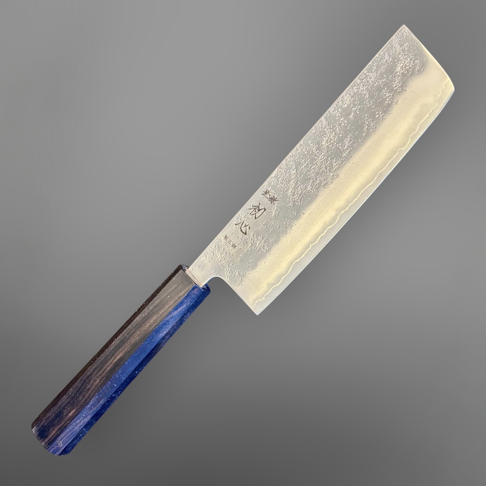 Hatsukokoro Ginrei Silver #3 Nakiri with mono ebony handle, alternate angled blade and handle view.