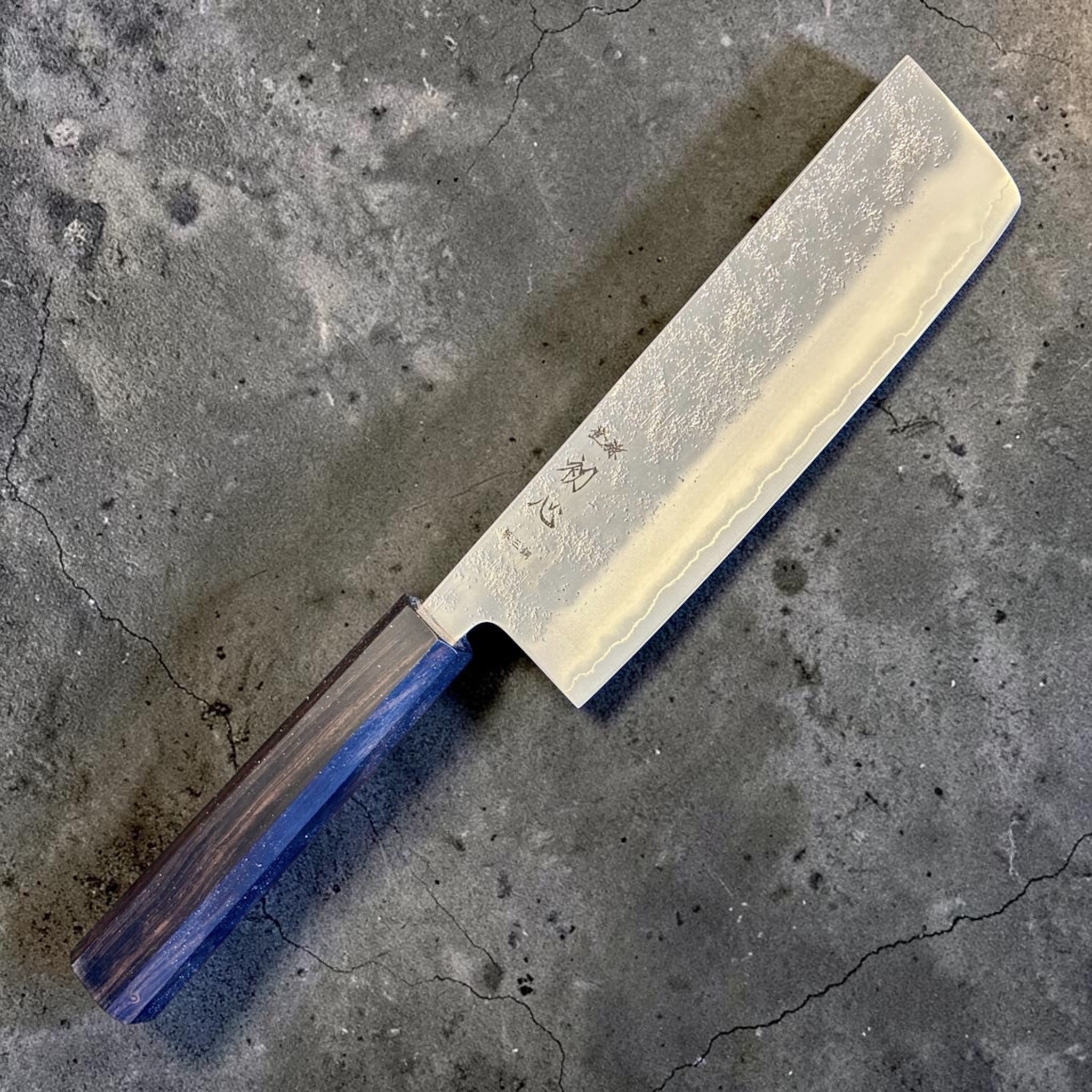 Hatsukokoro Ginrei Silver #3 Nakiri with mono ebony handle, alternate angled blade and handle view.
