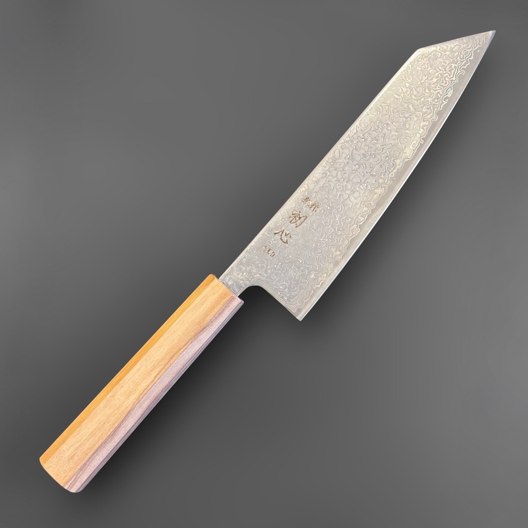 Hatsukokoro Hikari SLD Damascus Kurozome Bunka 170 mm with olive wood handle, angled front view of the full knife.