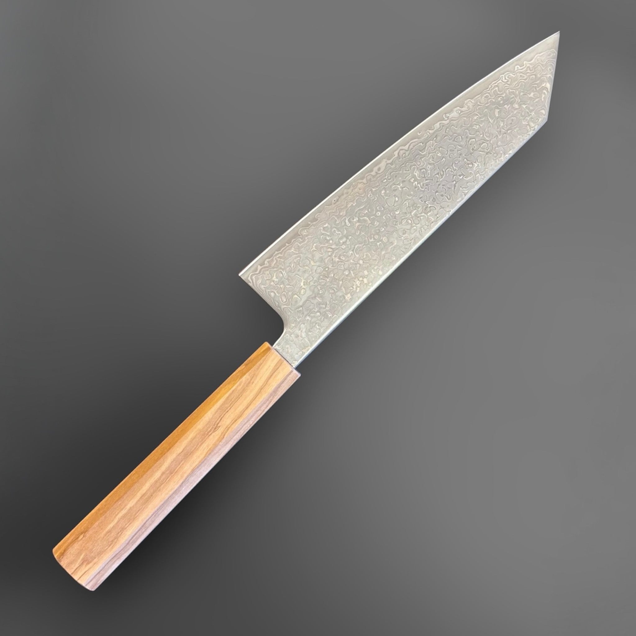 Hatsukokoro Hikari SLD Damascus Kurozome Bunka 170 mm with olive wood handle, angled reverse-side view of the blade and handle.