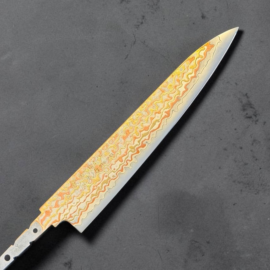 Hatsukokoro Hinotori V-Toku2 Rainbow Damascus Petty 150mm blade only, reverse side showing the etched rainbow Damascus pattern.