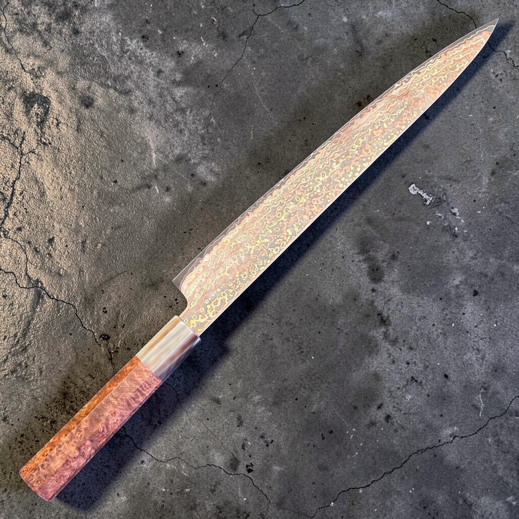 Hatsukokoro Hinotori V-Toku2 Rainbow Damascus Sujihiki 270 mm with amboyna burl handle, angled full-length product view.