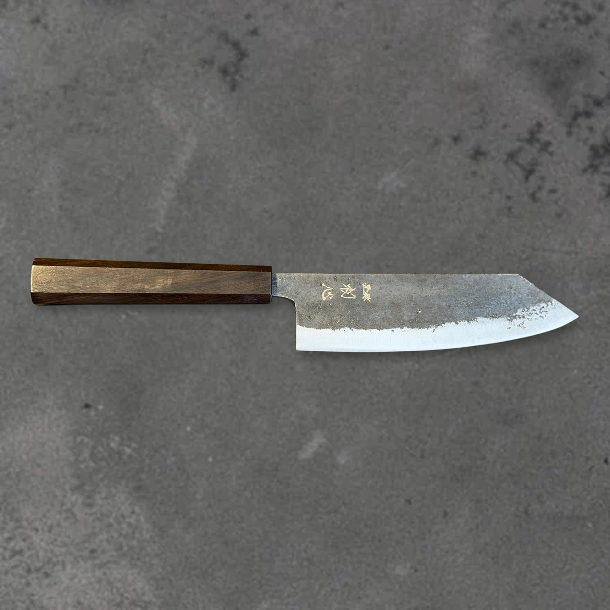 Hatsukokoro Kurogane Blue #2 Kurouchi 165mm bunka with ebony handle, shown in horizontal front profile with the full blade and handle visible.