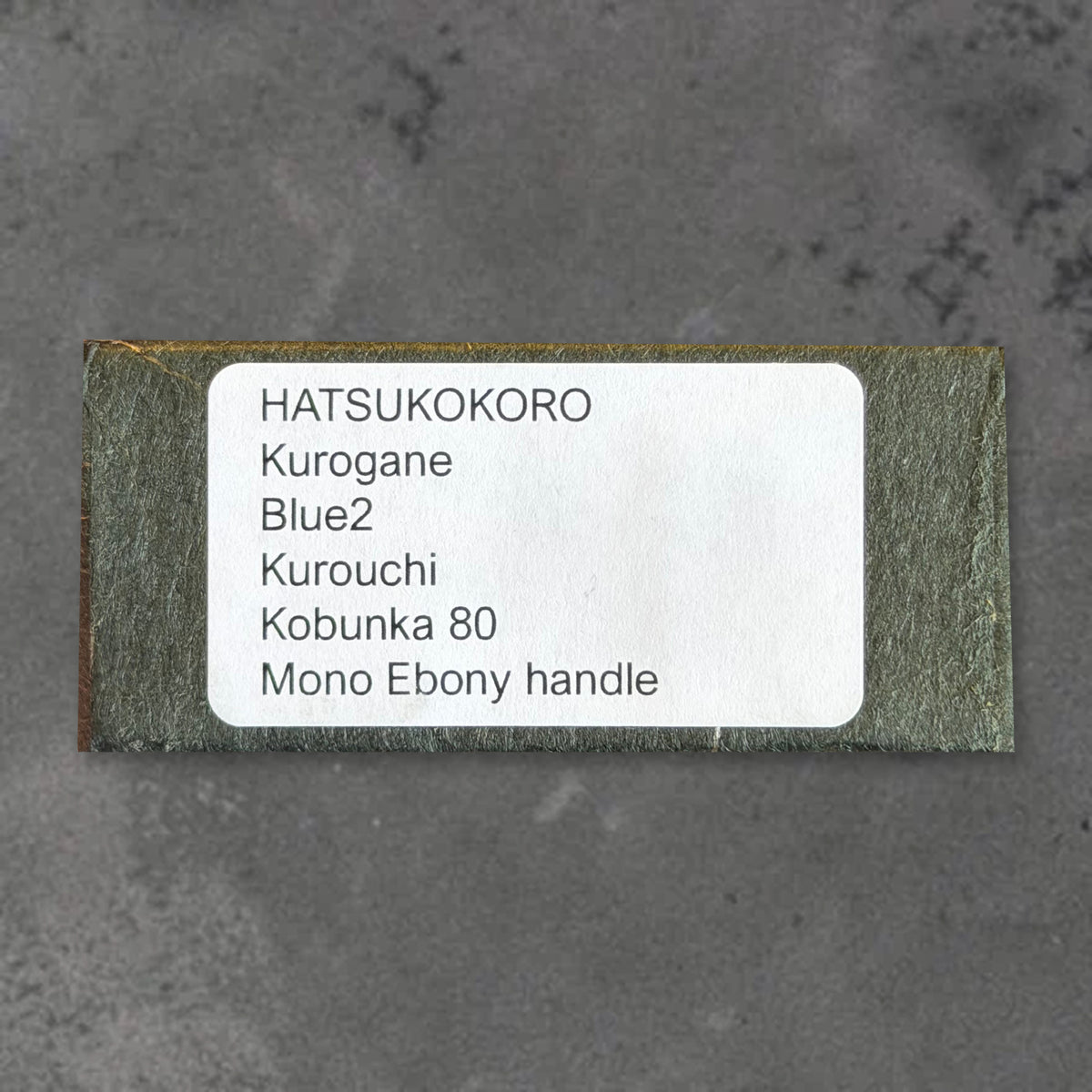 Box identification label for the Hatsukokoro Kurogane Blue #2 Kurouchi 80mm ko-bunka with ebony handle.