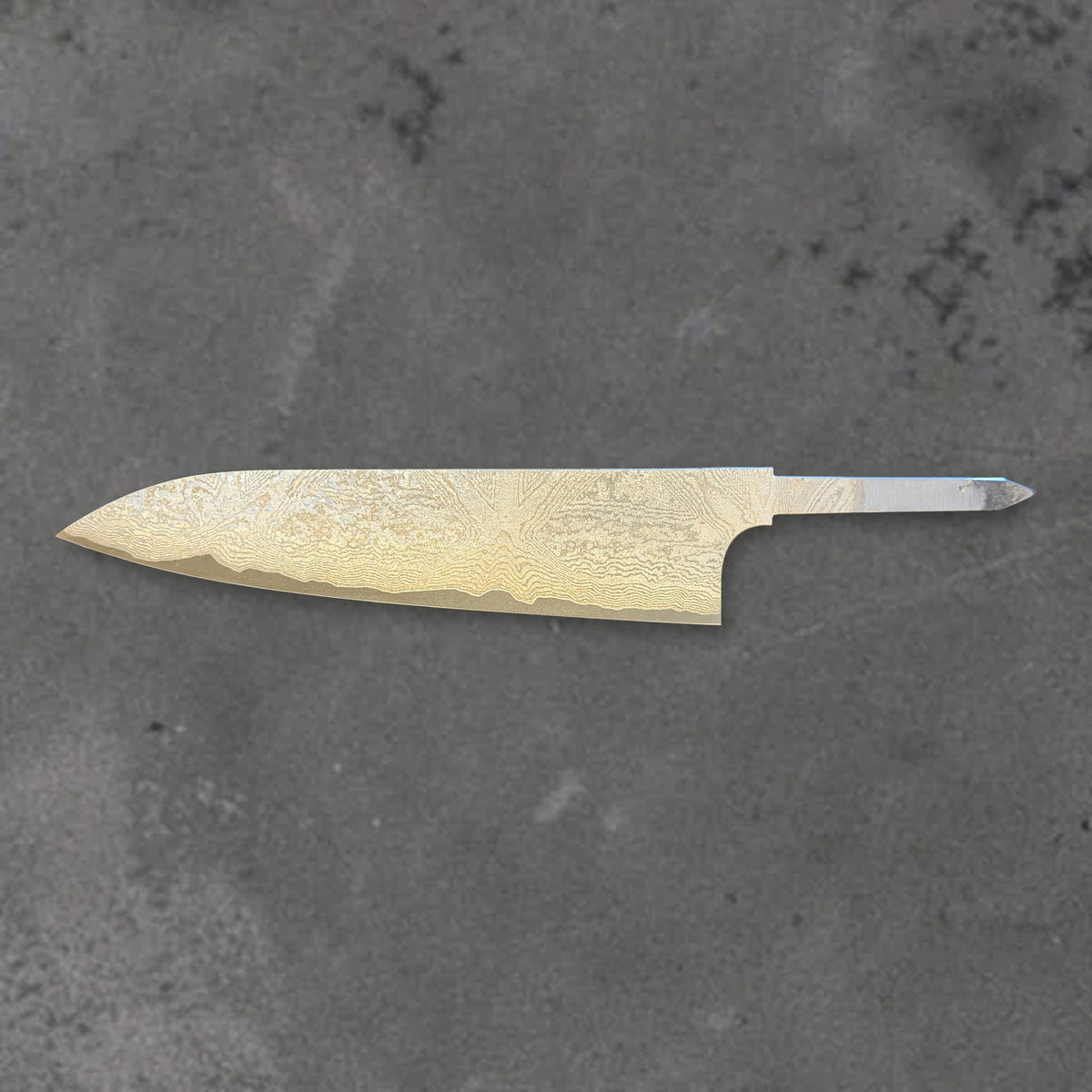 Hatsukokoro VG XEOS Damascus 210mm gyuto blade without a handle, shown in horizontal reverse profile with the full blade and tang visible.