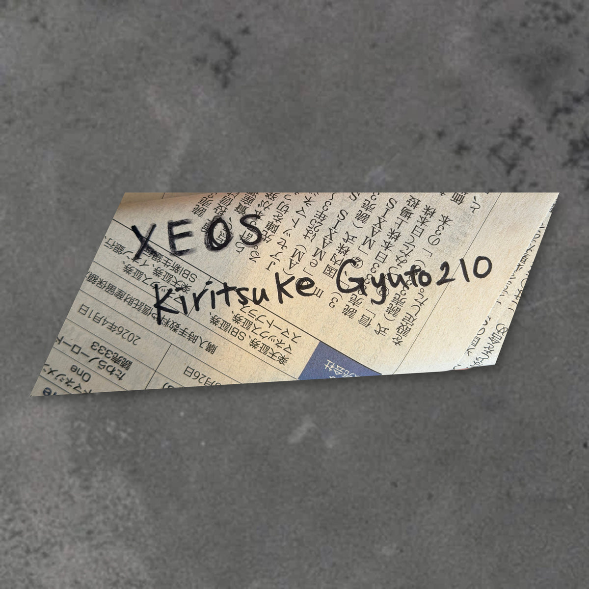 Handwritten packaging label identifying the Hatsukokoro VG XEOS Damascus 210mm kiritsuke blade without a handle.