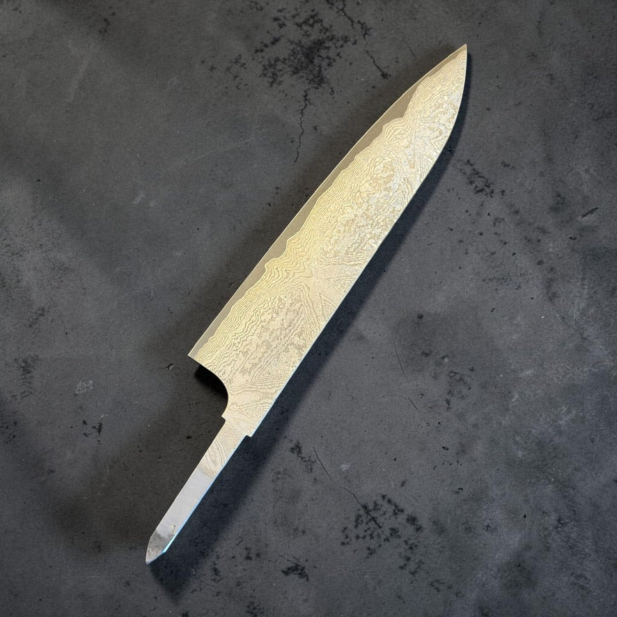 Reverse side of the Hatsukokoro VG-XEOS Kurozome Damascus Gyuto 210mm blade, showing the layered pattern and exposed tang.