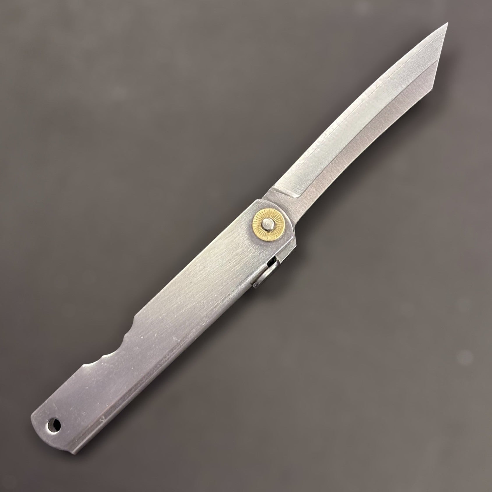 Side profile of a Higonokami VG-10 folding pocket knife with blade open.