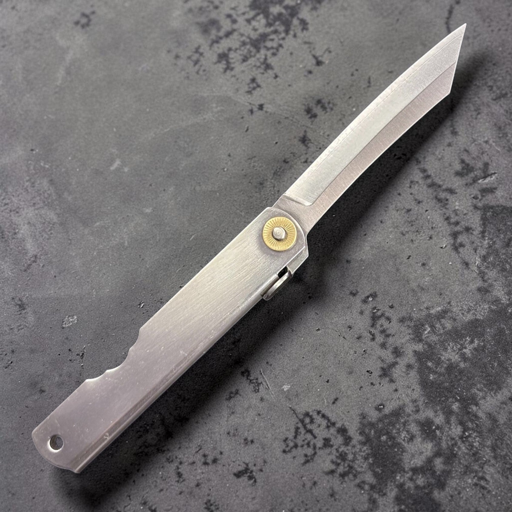 Side profile of a Higonokami VG-10 folding pocket knife with blade open.
