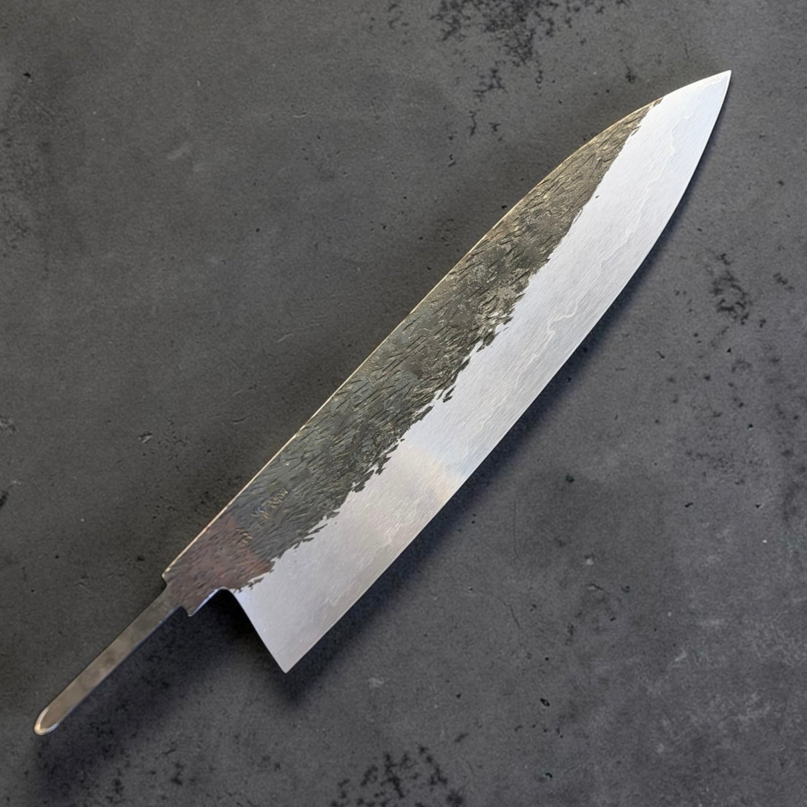 Isamitsu Aogami Super kurouchi tsuchime gyuto 240mm blade only angled view