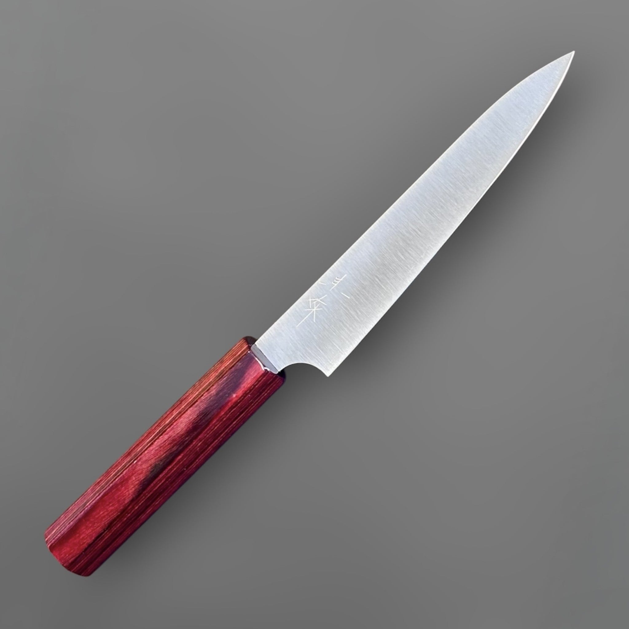 Kei Kobayashi SG2 Migaki petty knife with red wa handle, angled maker’s mark view showing the kanji near the heel and fine satin finish.