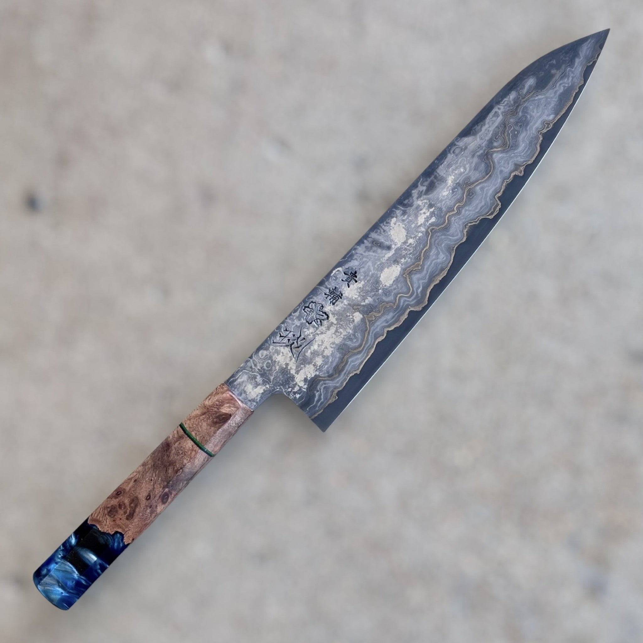 Kisuke Manaka KokuENN Gyuto 262mm with Prisma Knife Handle, main product photo showing the Damascus-pattern blade and custom Prisma handle.