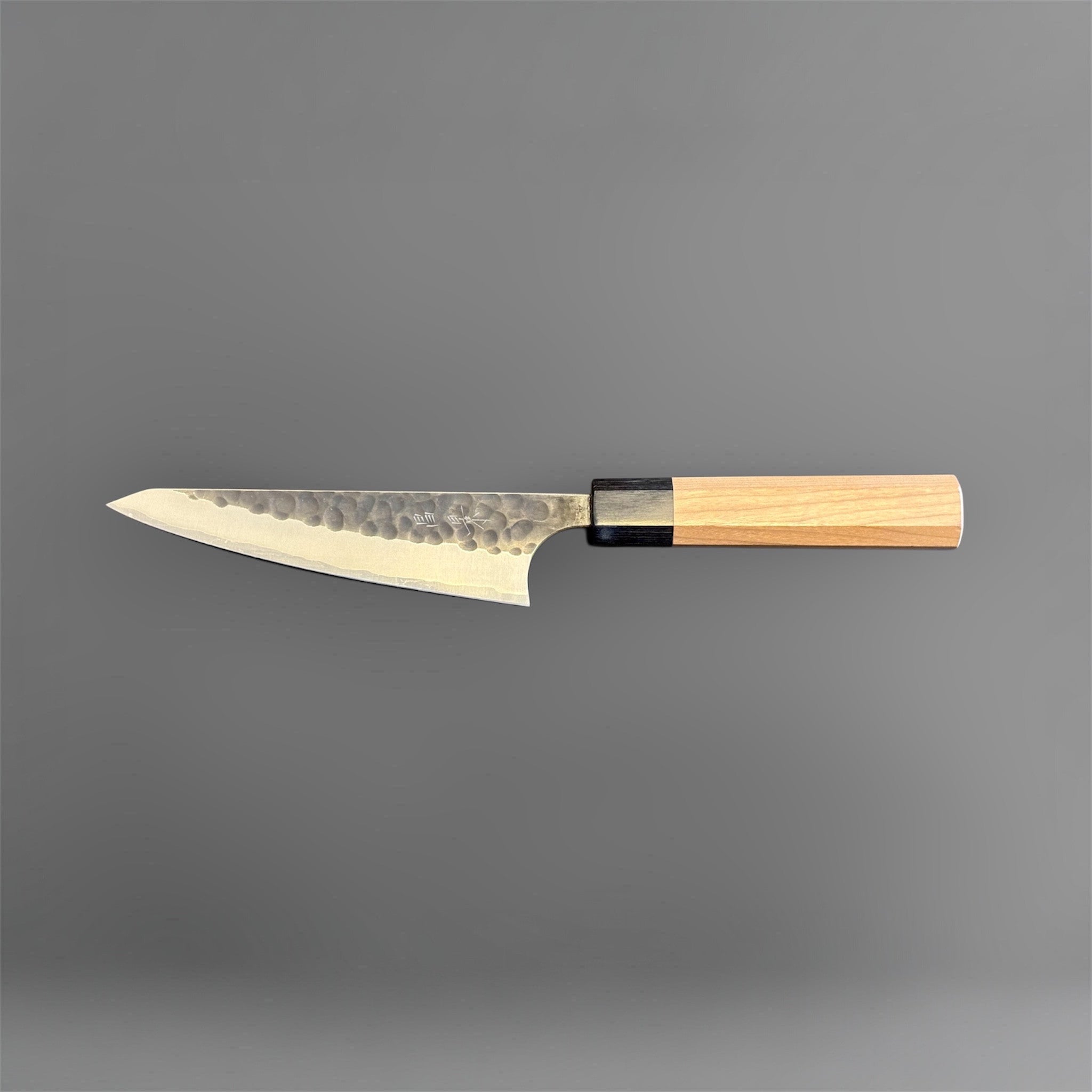 Masakage Koishi Honesuki Japanese knife, full opposite-side profile highlighting the hammered blade texture and wa handle.