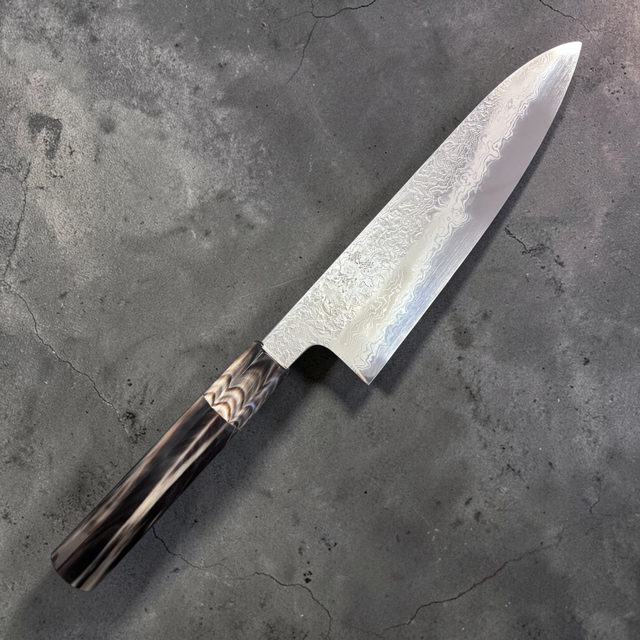 Masuda Yoshihide Blue #1 Damascus Gyuto 190 mm, primary face highlighting swirling Damascus pattern.
