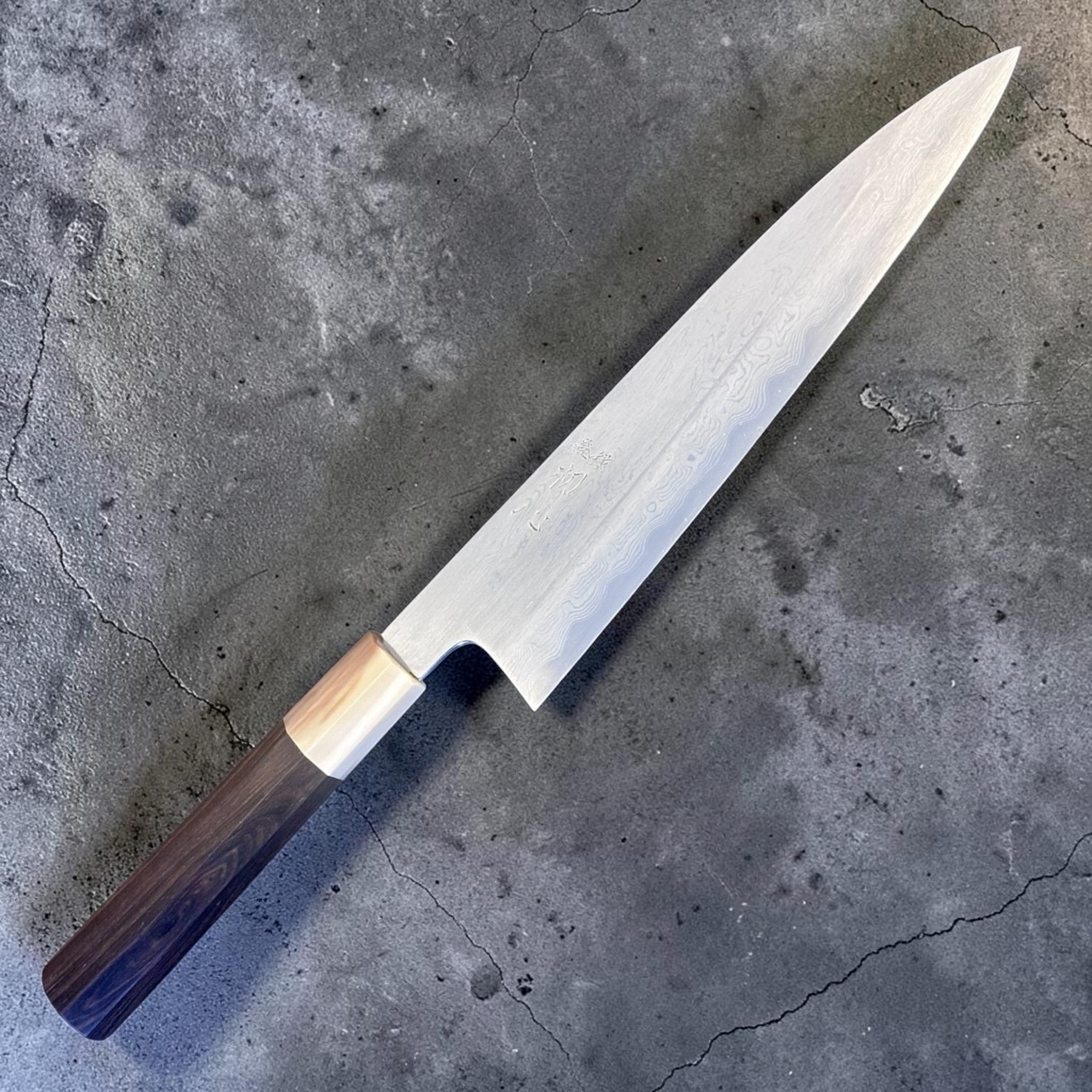 Nakagawa Satoshi Blue #1 Damascus Gyuto 225 mm with ebony and horn handle, alternate angled view highlighting Damascus pattern.