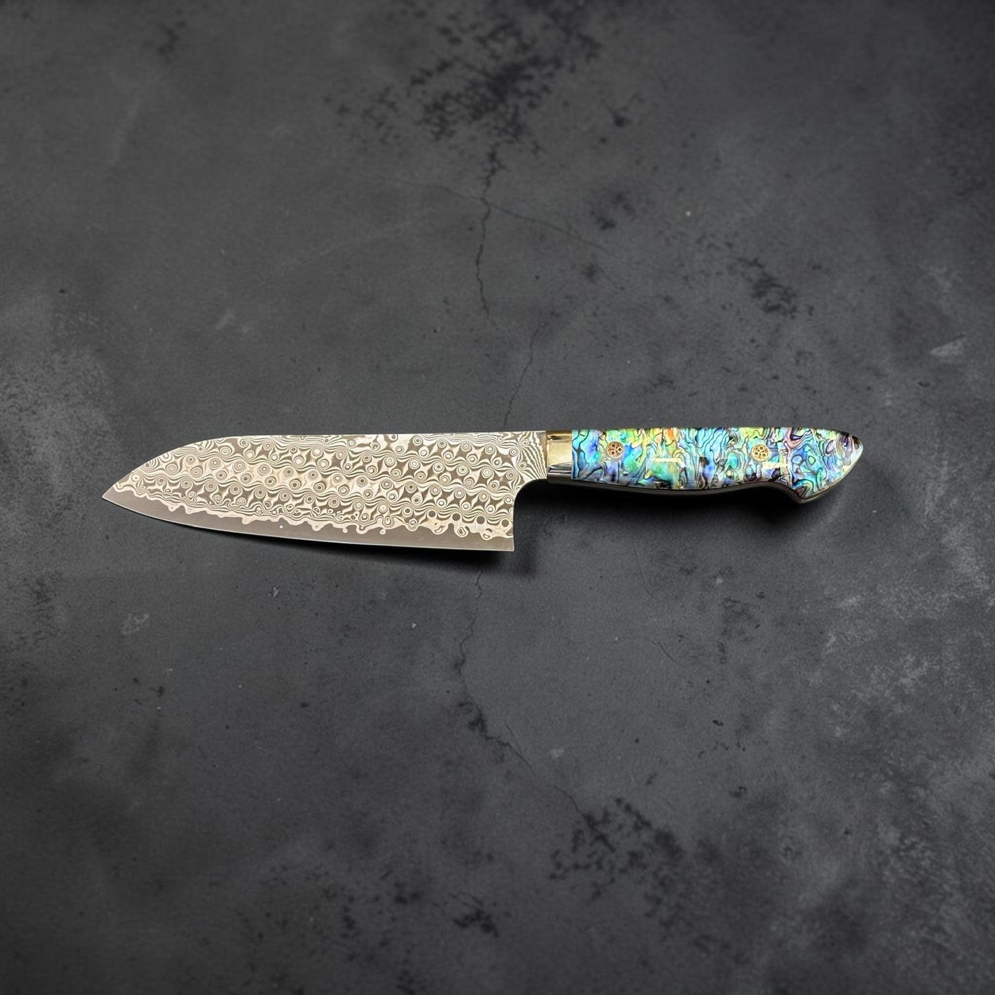 Nigara Anmon Damascus Santoku SG2 180 mm with Abalone Western Handle, full reverse profile view showing Anmon Damascus santoku blade and abalone western handle.