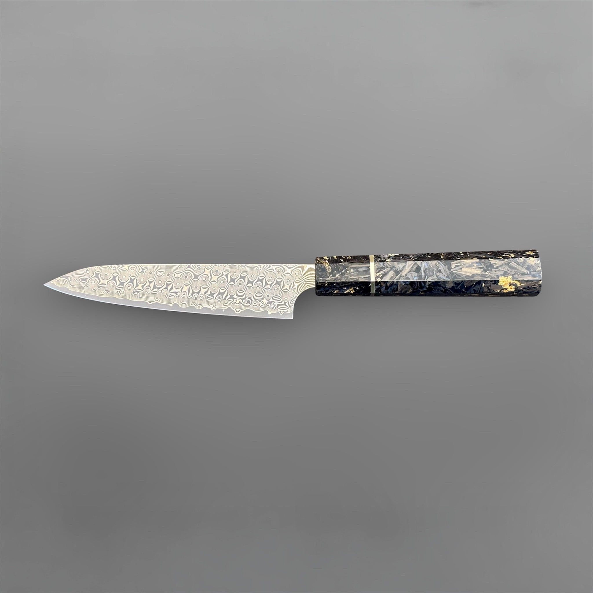 Nigara Anmon SG2 Petty 150 mm with carbon fiber and gold fleck handle, reverse horizontal full-profile product photo.