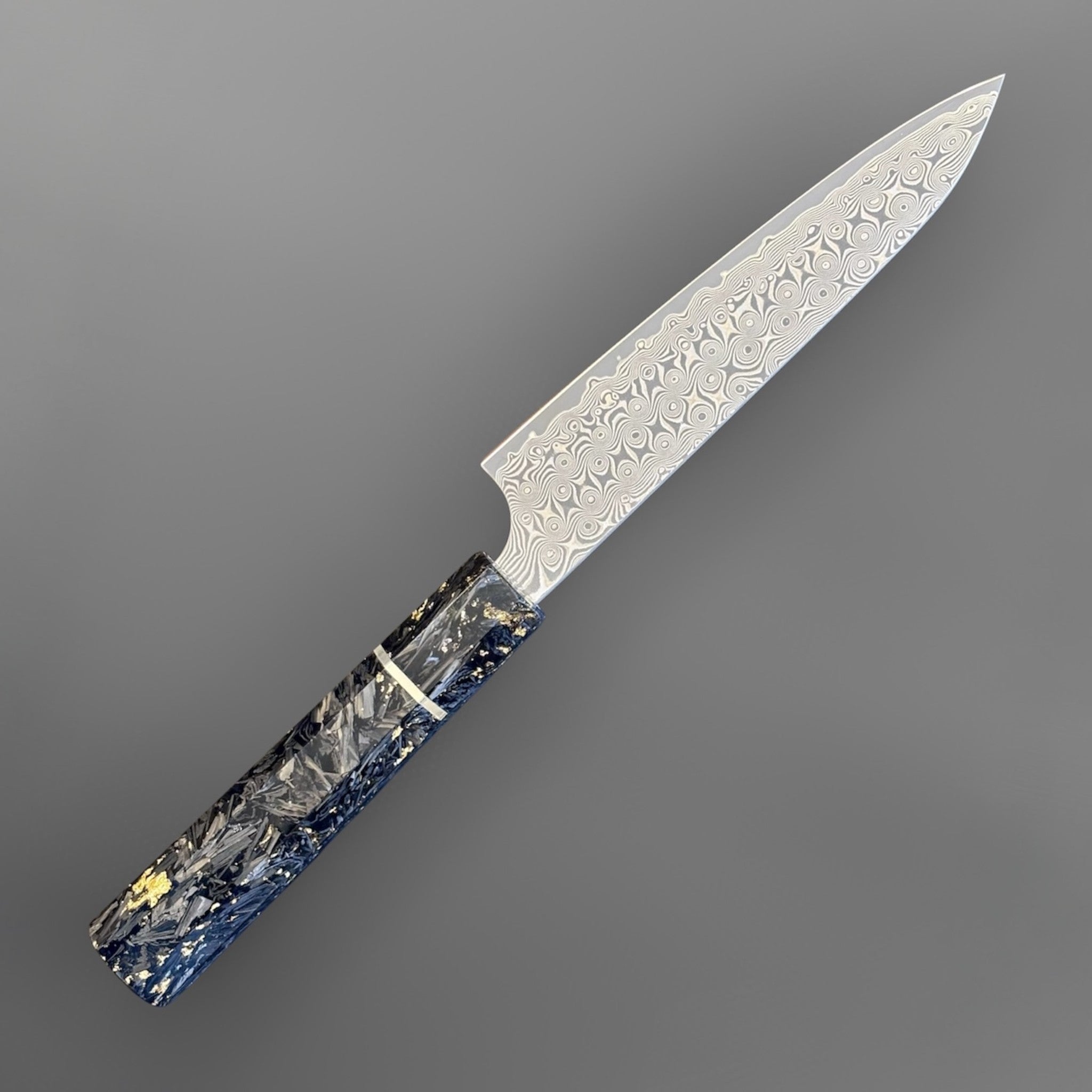 Nigara Anmon SG2 Petty 150 mm with carbon fiber and gold fleck handle, angled full-knife view showing the blade and handle.