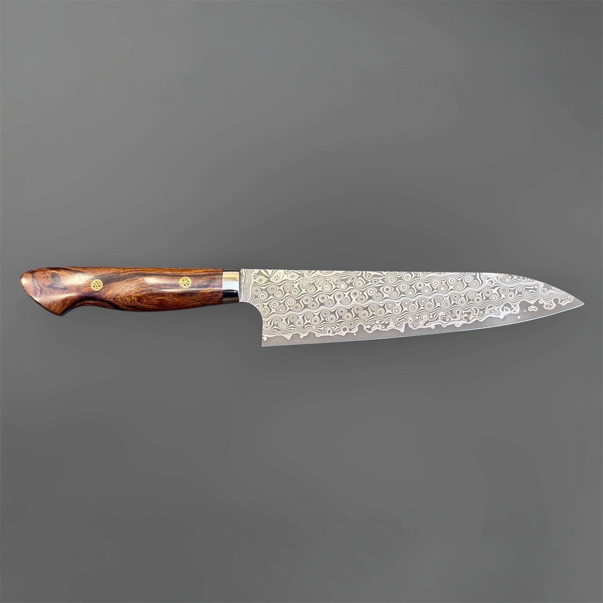 Nigara Hamono Anmon SG2 210 mm Gyuto with ironwood western handle, full side profile showing Anmon Damascus pattern.