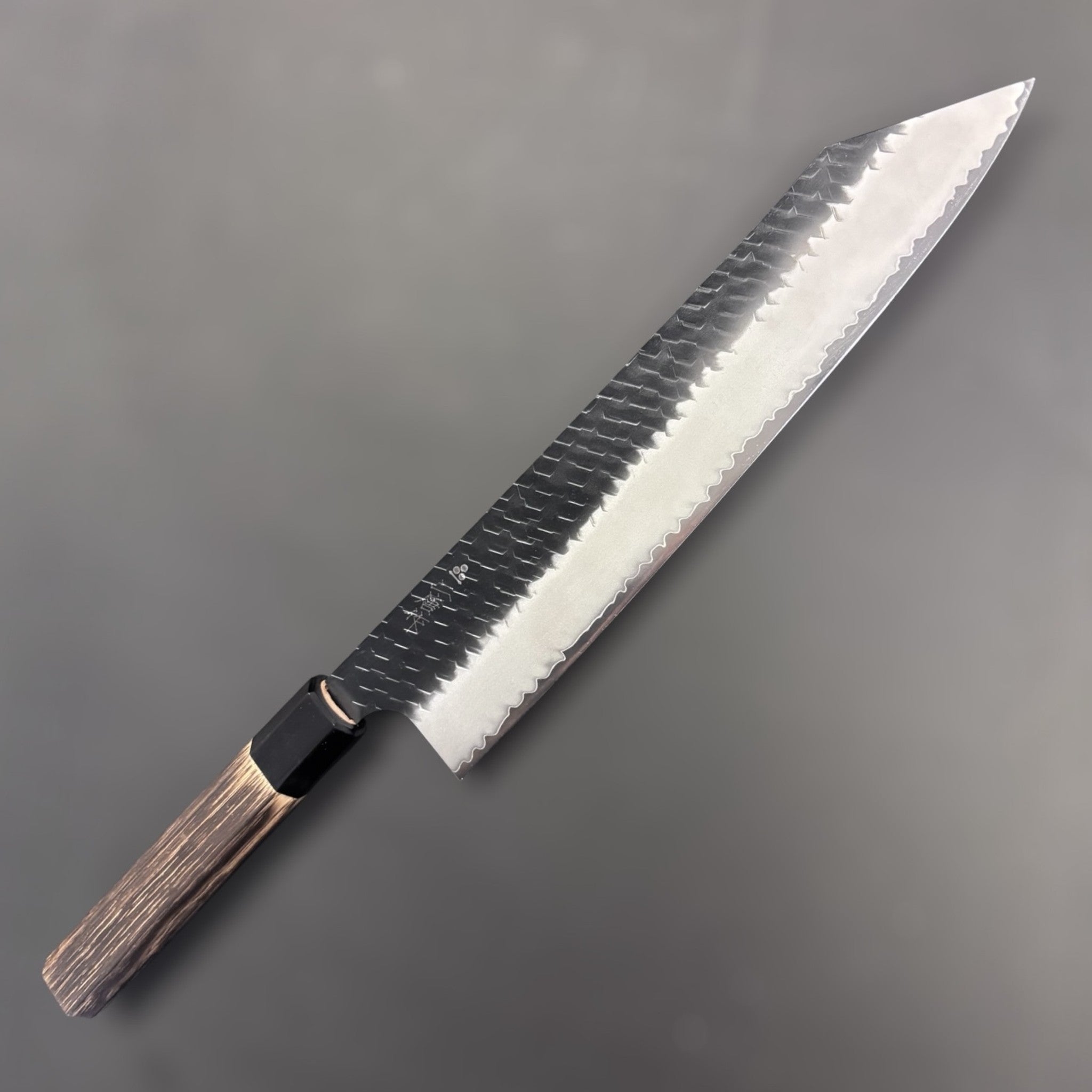 Nigara Hamono SG2 Kurouchi Tsuchime Kiritsuke 270 mm, reverse side with maker's kanji visible on the blade.