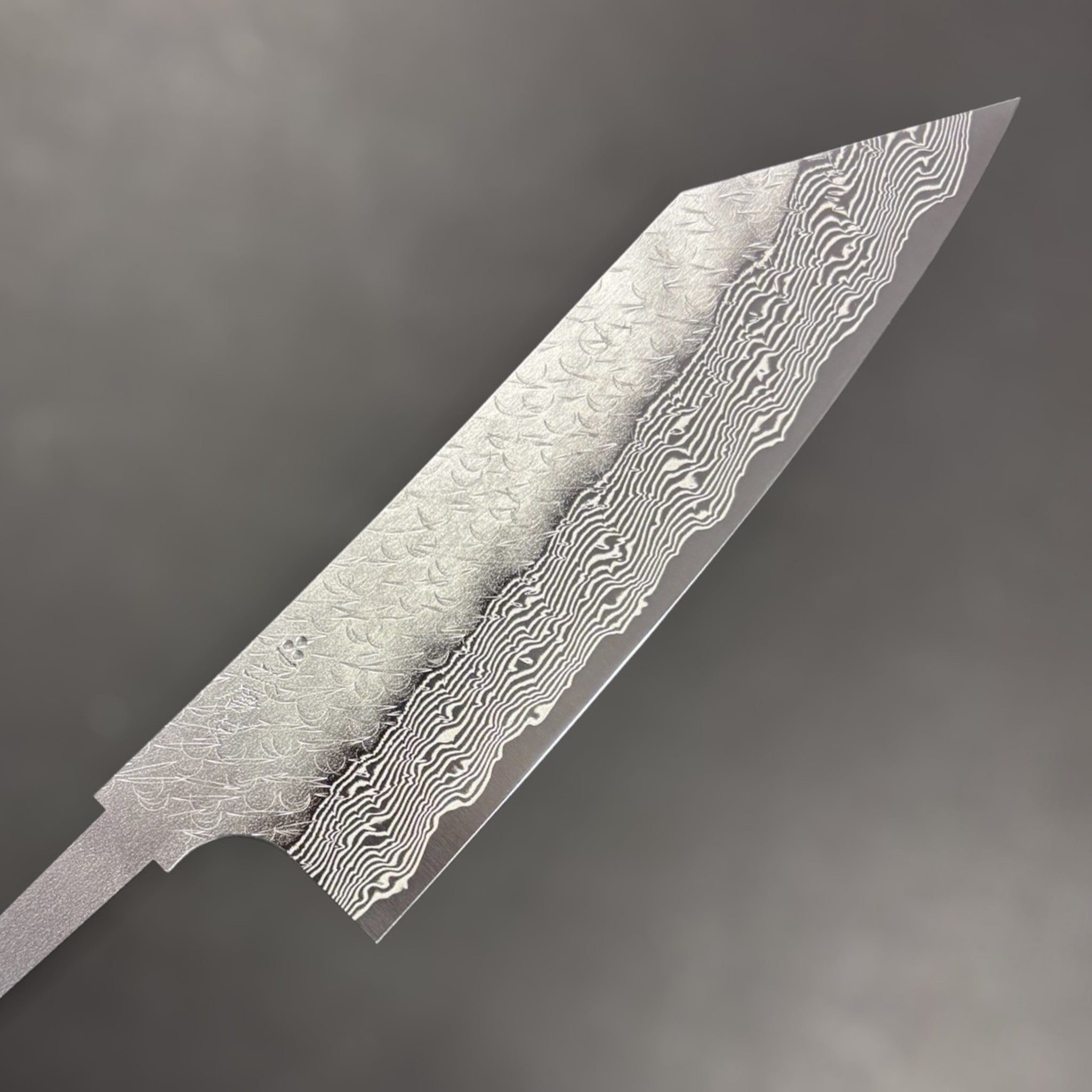 Nigara Strix Damascus Bunka 180 mm blade with exposed tang, full side profile highlighting the dramatic kiritsuke-style tip and etched pattern.