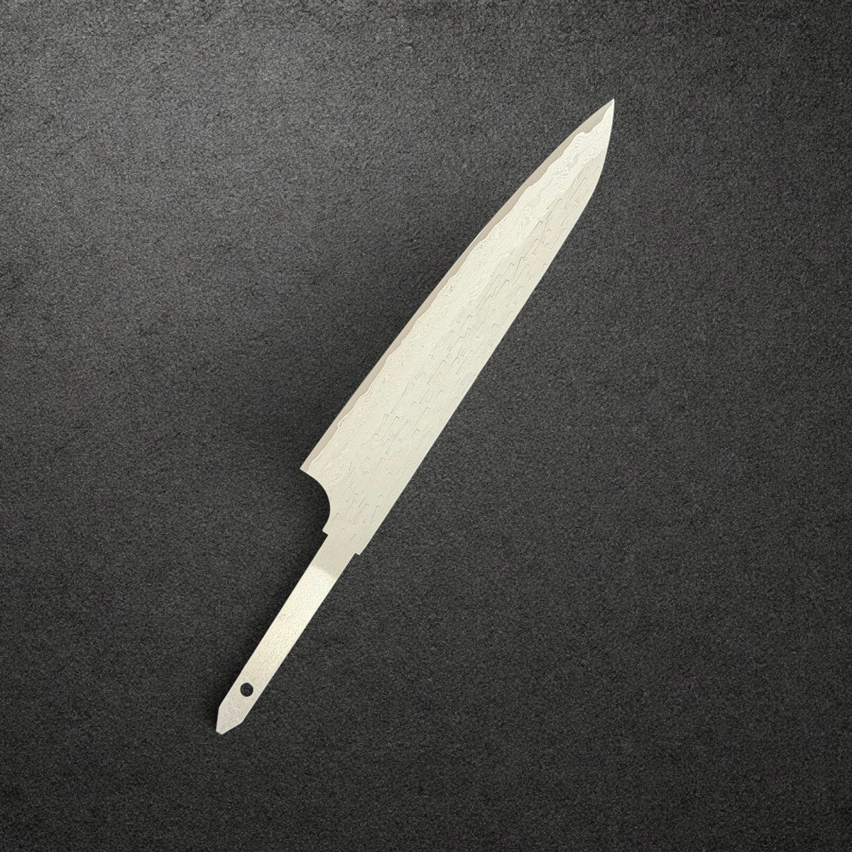 Nigara VG-XEOS Tsuchime Petty 150mm blade only, reverse angled view showing Damascus and exposed tang