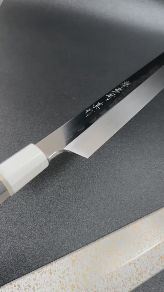 
                  
                    Load and play video in Gallery viewer, Sakai Takayuki Mirrored Honyaki Water-Quenched Kiritsuke-Yanagiba 300mm SHINUCHI with Saya Sheath
                  
                