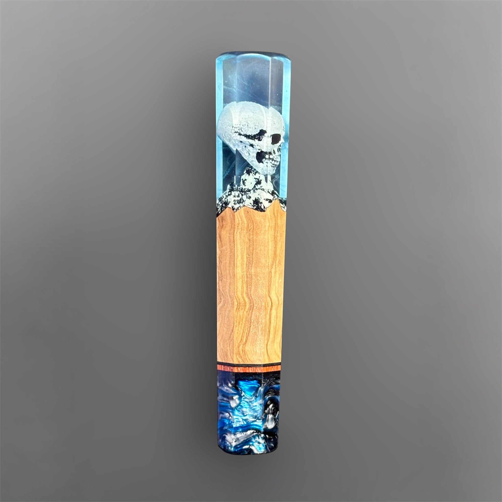 Prisma Knife Handle 2, blue resin and wood wa handle with skull detail and blue-black resin end cap.