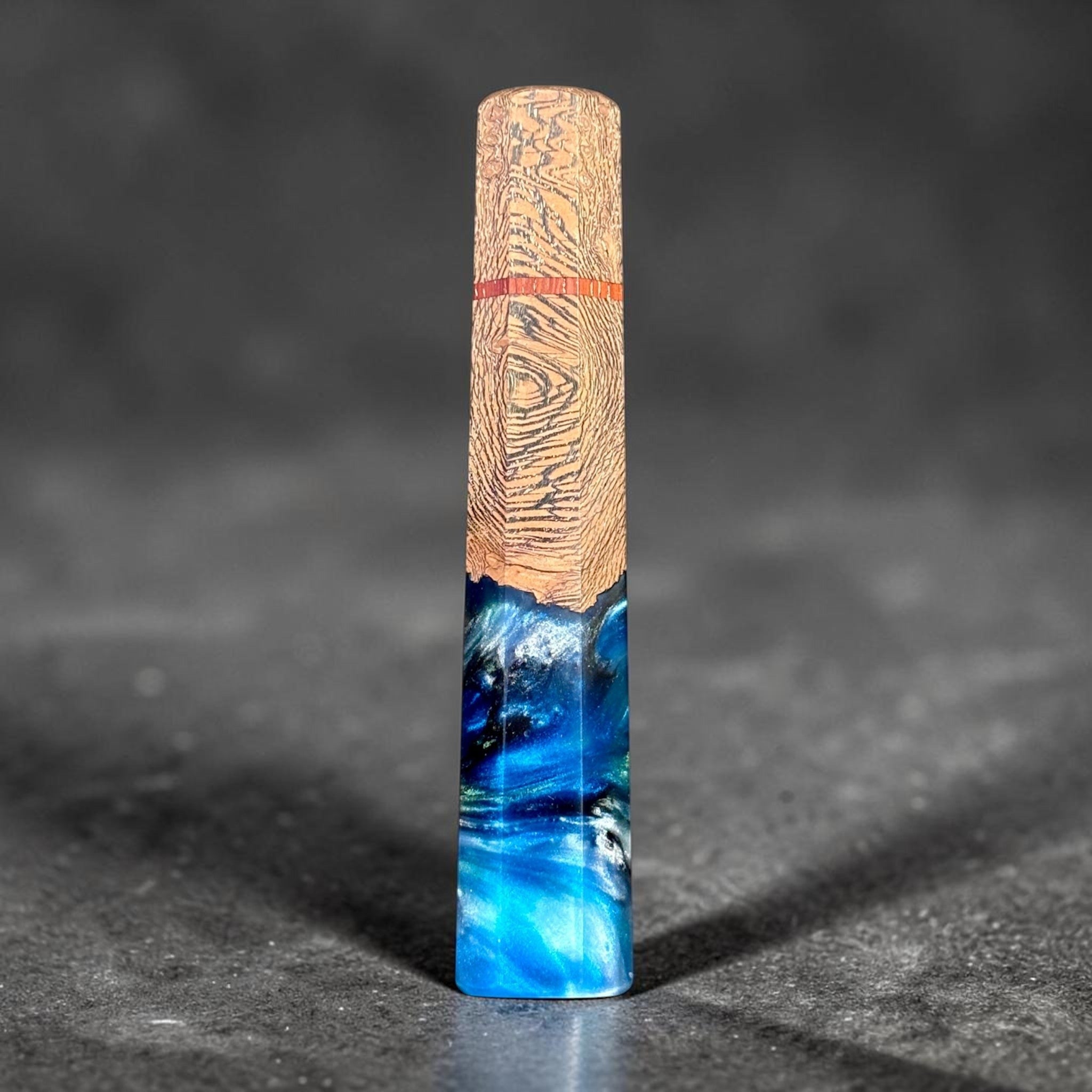 Prisma Knife Handle 4, blue resin and textured wood wa handle with red accent spacer.