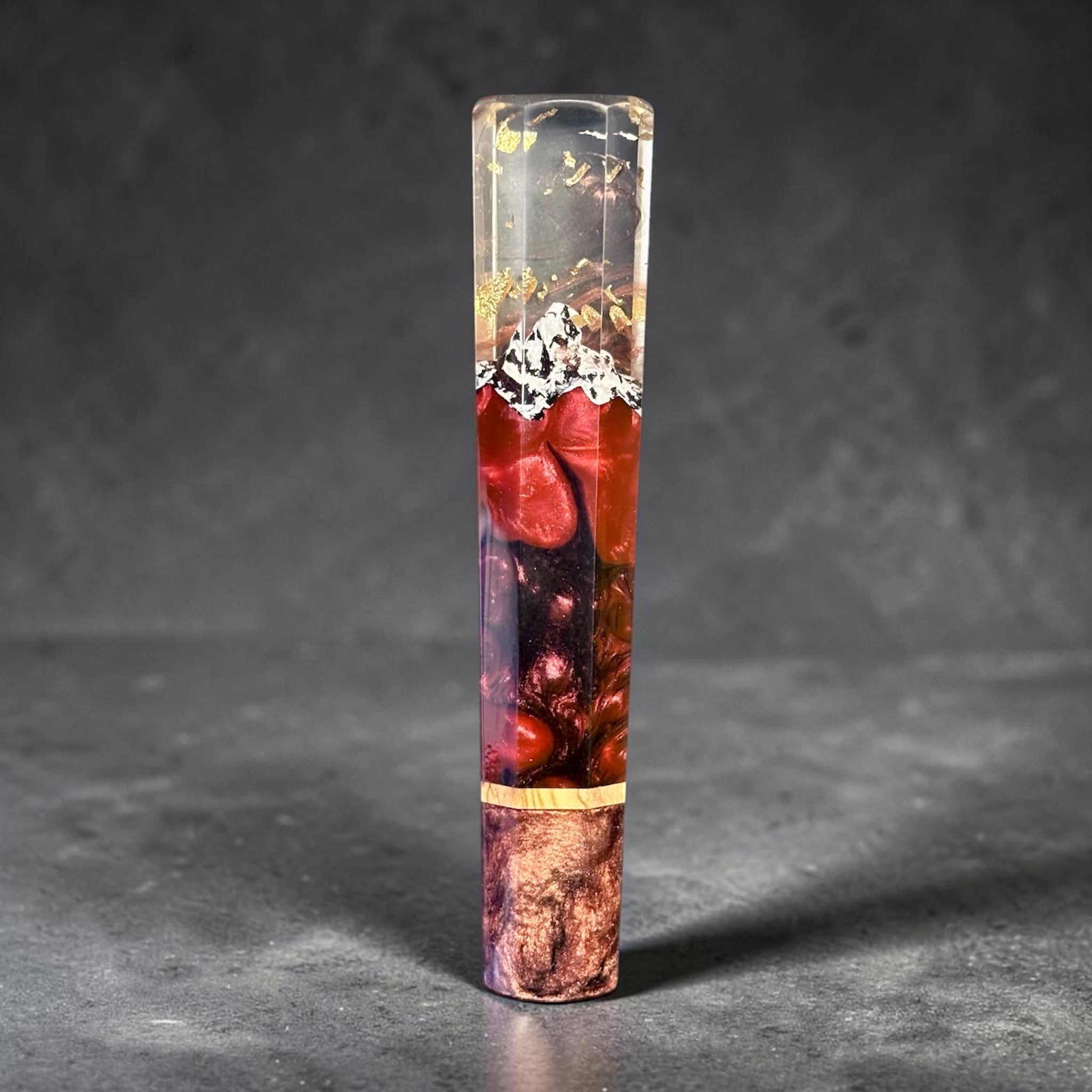 Prisma Knife Handle 6, red and smoky resin wa handle with gold flecks and pale accent spacer.