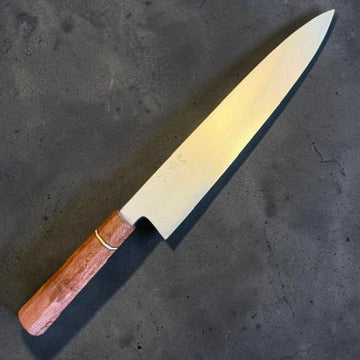 Satoshi Nakagawa and Morihiro Blue #1 Damascus Gyuto 240mm with reddish Prisma handle, alternate angled view.