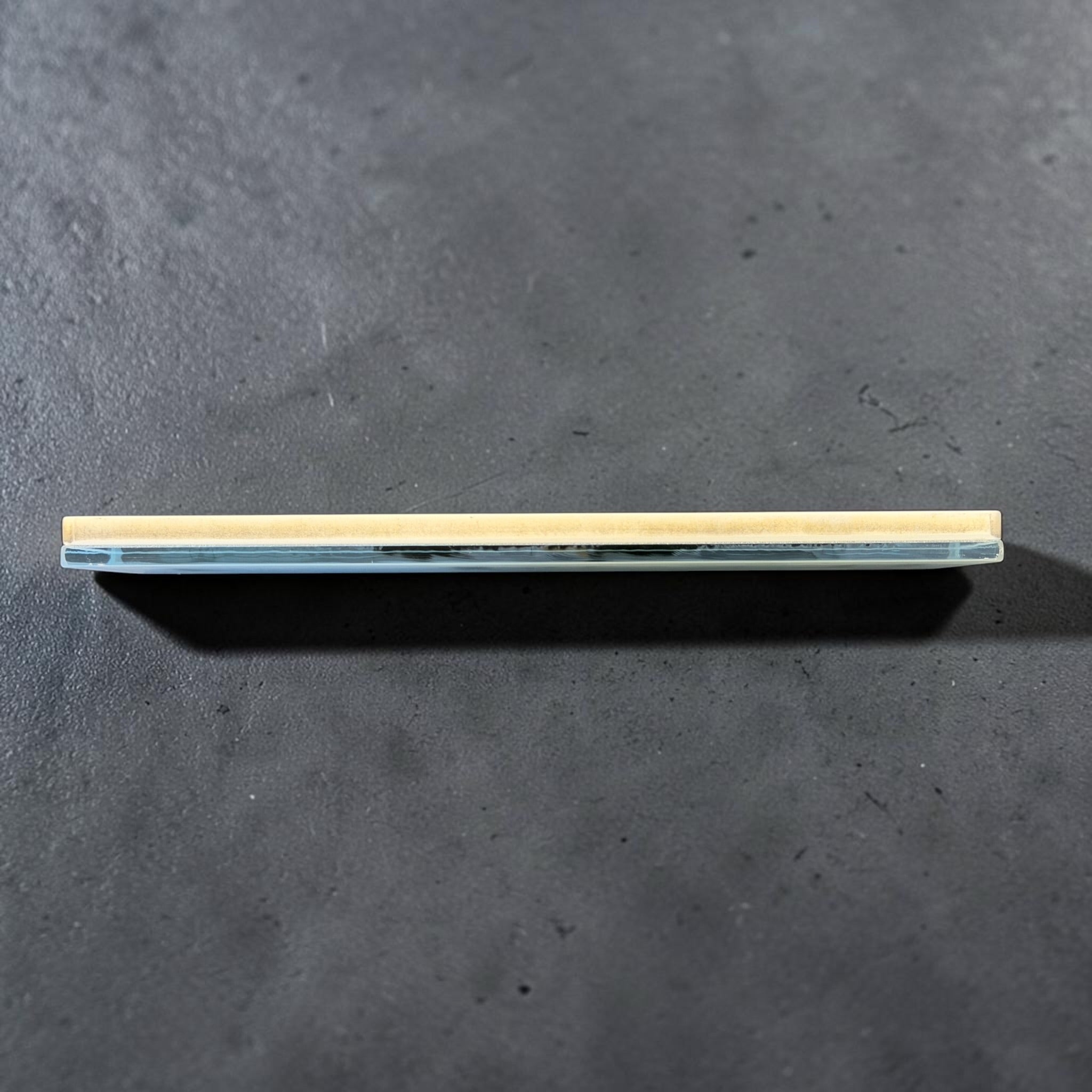 Shapton GlassStone 2000 whetstone side profile showing the abrasive layer and tempered glass base