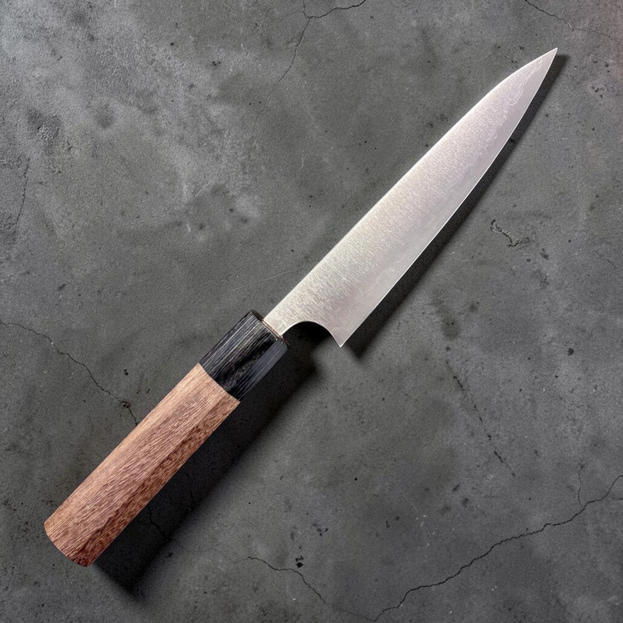 Shibata Koutetsu Aogami Super Petty 135 mm, right‑side profile showing walnut/ebony wa handle and hazy migaki blade.