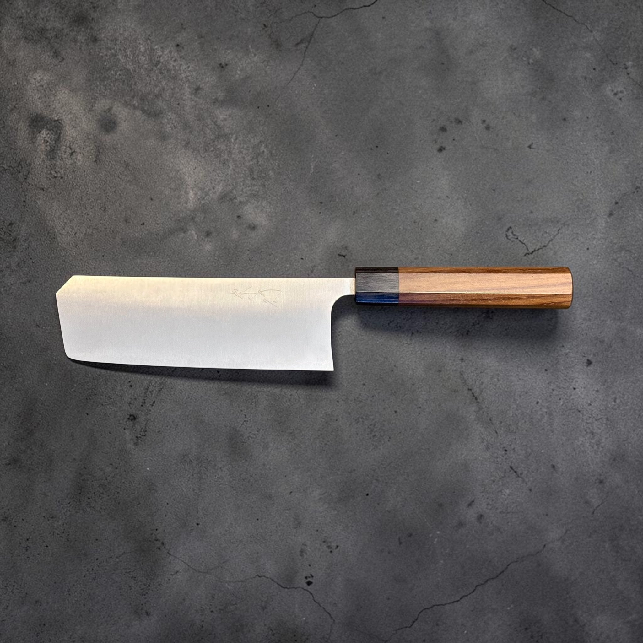 Shibata Koutetsu Chromax Boss Nakiri, full profile view with blade facing left and handle to the right.