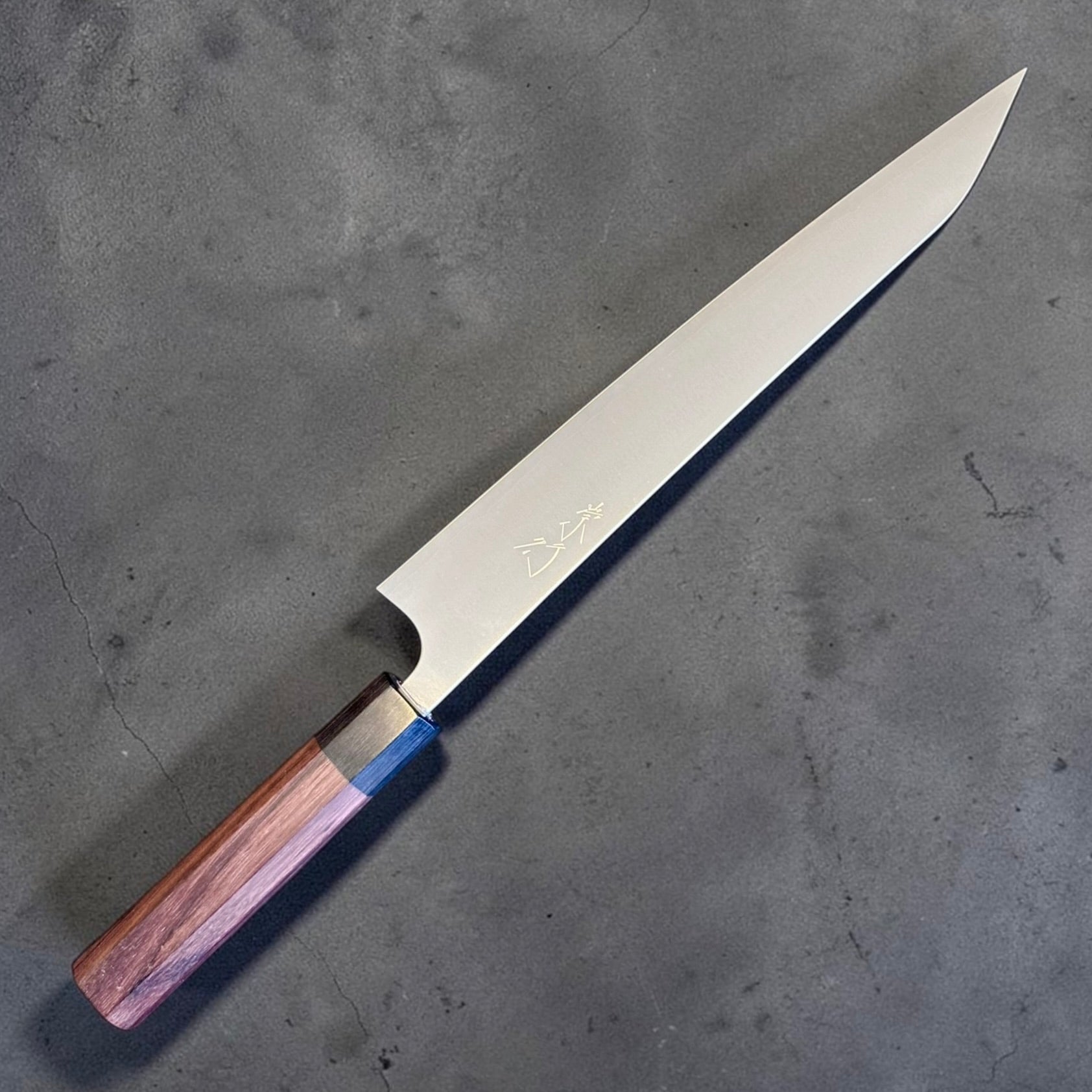 Shibata Koutetsu Chromax Sujihiki 240 mm, angled blade view showing kanji engraving and slim pointed tip.