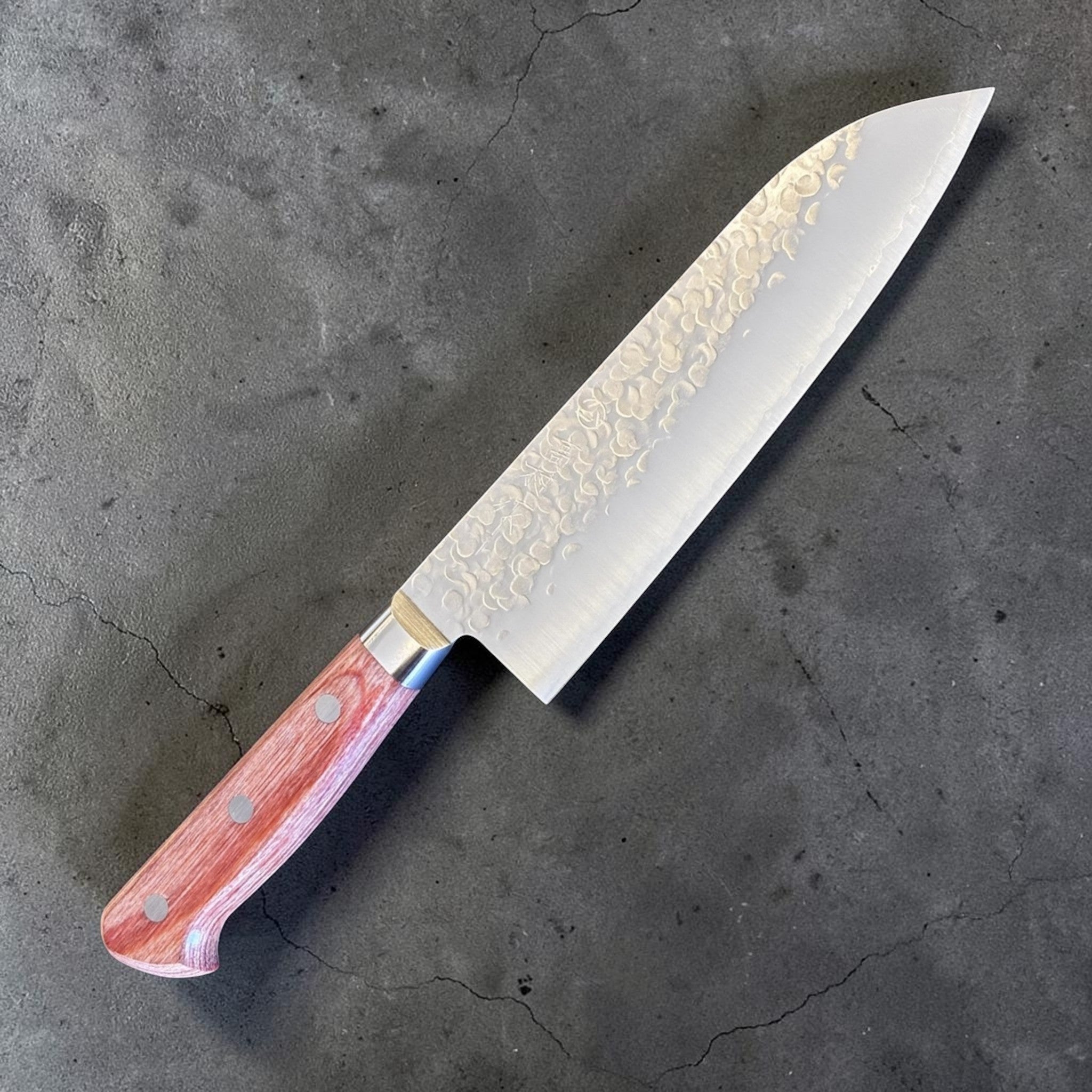 Takamura Chromax Santoku 170 mm, angled product view highlighting the santoku blade shape and handle pins.