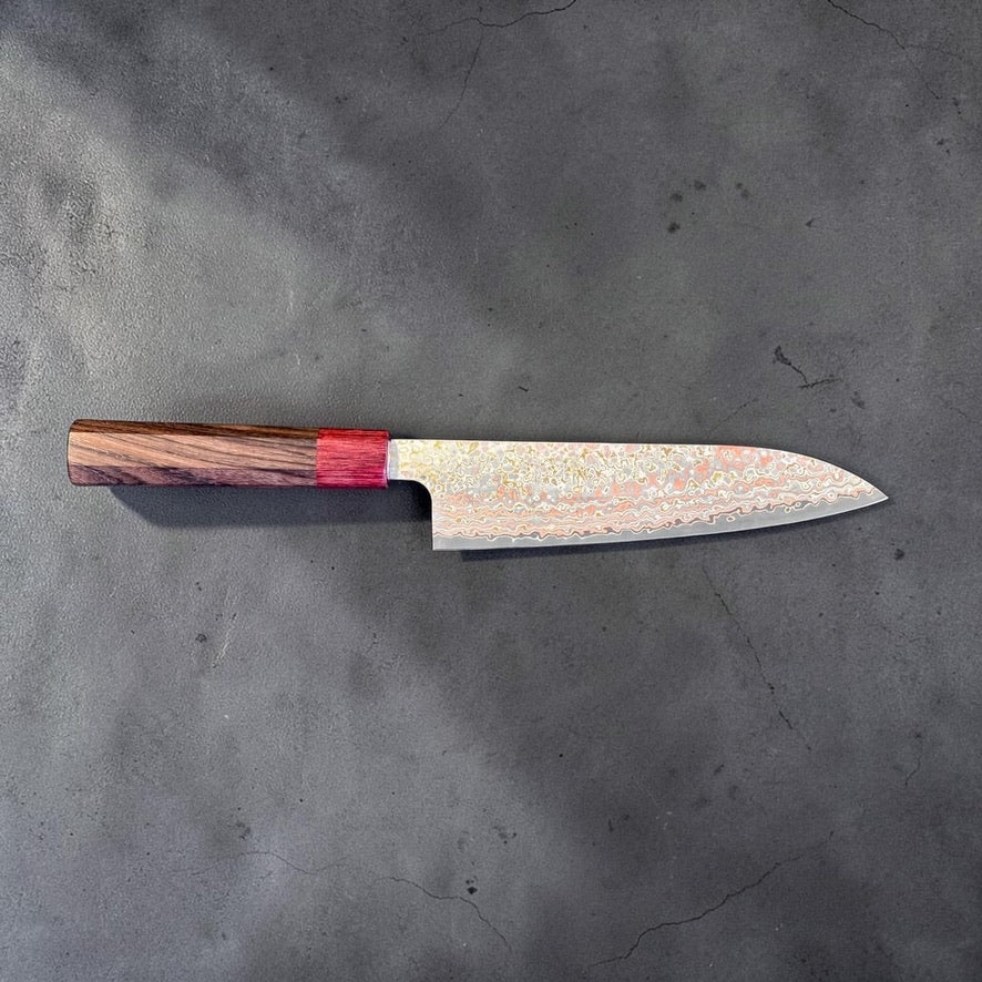 Reverse full profile of the Takeshi Saji VG-10W Nashiji Rainbow Gyuto 180mm showing the patterned cladding and red ferrule.